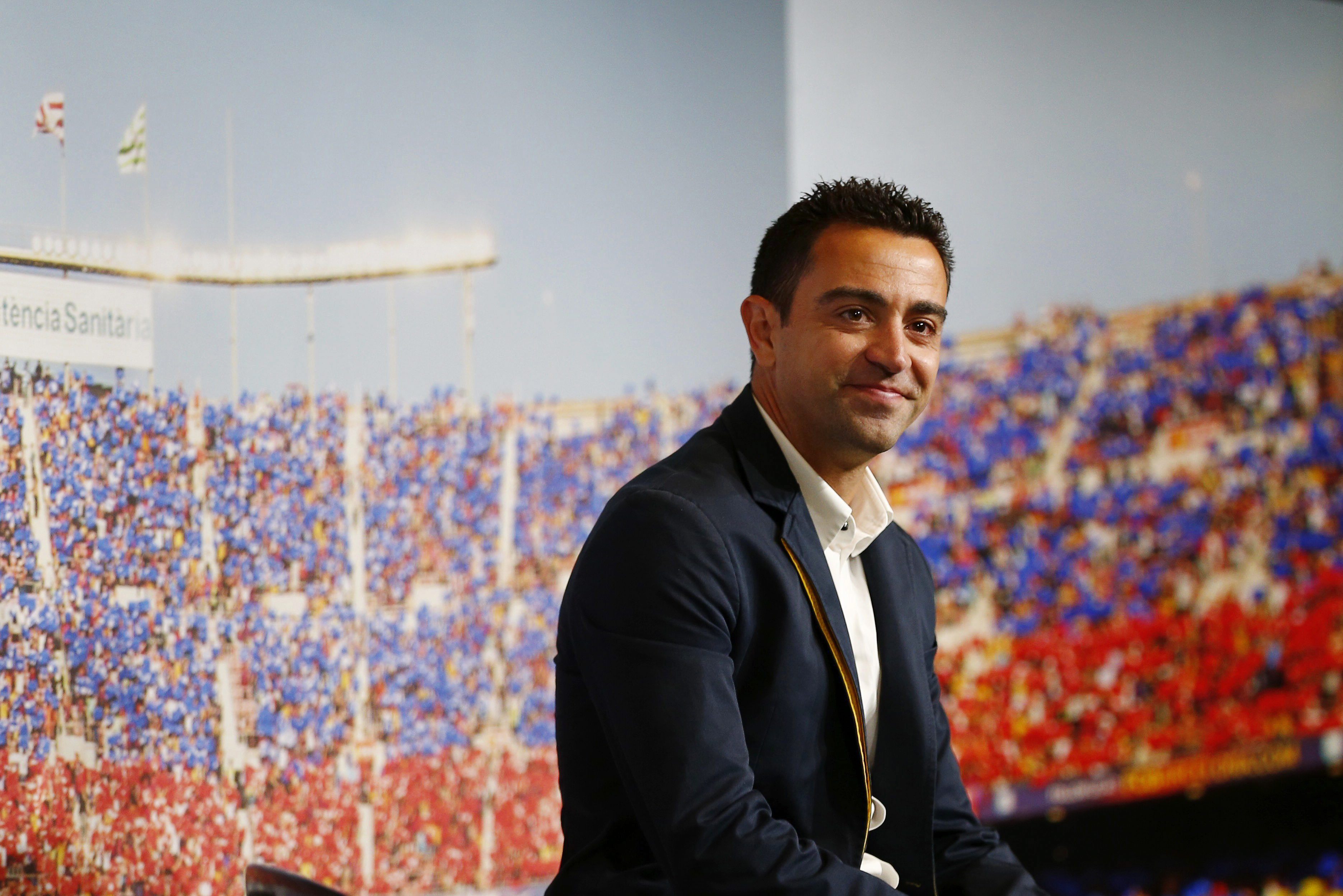 epa04781642 FC Barcelona's Spanish midfielder Xavi Hernandez attends his farewell ceremony from the Spanish Primera Division soccer club in Barcelona, northeastern Spain, 03 June 2015. Xavi will join Qatar's Al-Sadd Sports Club after playing 17 seasons for Barca.  EPA/ALEJANDRO GARCIA