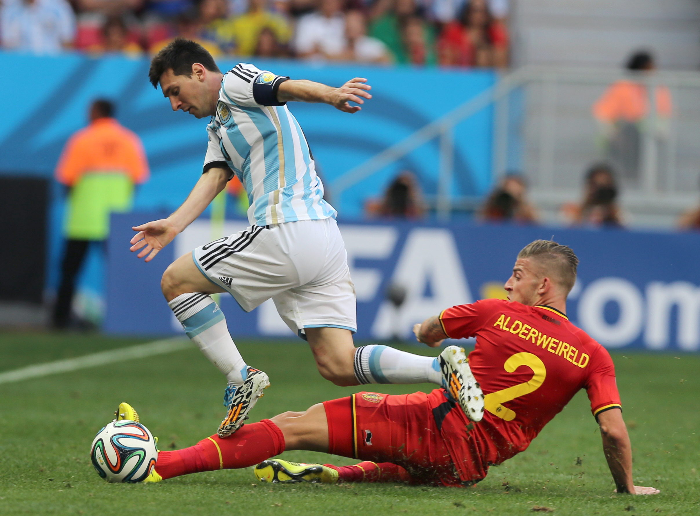 epa04301130 Lionel Messi (L) of Argentina vies with Toby Alderweireld of Belgium during the FIFA World Cup 2014 quarter final match between Argentina and Belgium at the Estadio Nacional in Brasilia, Brazil, 05 July 2014.
(RESTRICTIONS APPLY: Editorial Use Only, not used in association with any commercial entity - Images must not be used in any form of alert service or push service of any kind including via mobile alert services, downloads to mobile devices or MMS messaging - Images must appear as still images and must not emulate match action video footage - No alteration is made to, and no text or image is superimposed over, any published image which: (a) intentionally obscures or removes a sponsor identification image; or (b) adds or overlays the commercial identification of any third party which is not officially associated with the FIFA World Cup) EPA/BALLESTEROS EDITORIAL USE ONLY