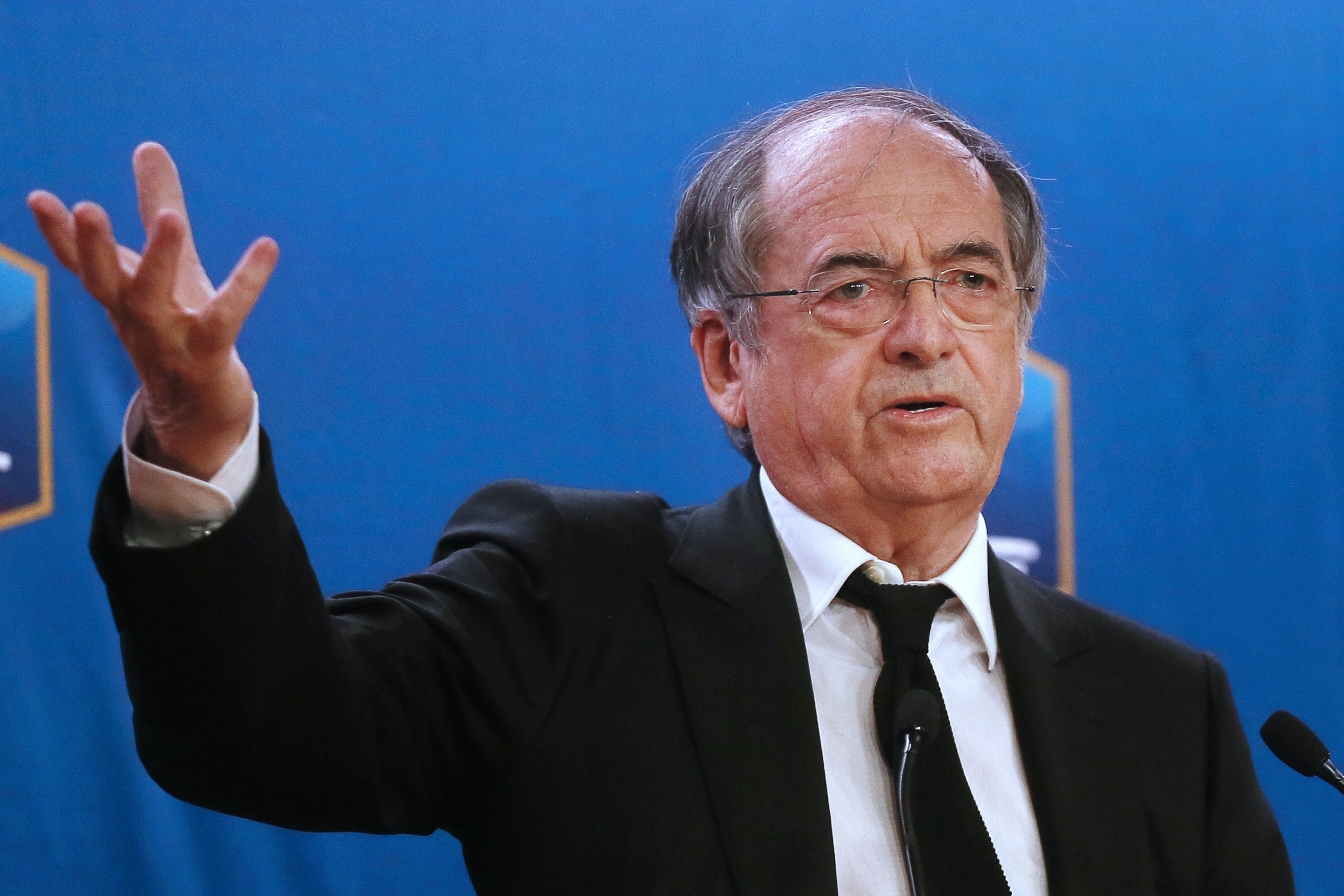 epa05063722 Noel Le Graet, President of the French Football Federation (FFF), gestures during a press conference at the FFF headquarters in Paris, France, 10 December 2015. The French Football Federation suspends Real Madrid striker Karim Benzema from the national team over a sex-tape blackmail case involving his France teammate Mathieu Valbuena, media reports said.  EPA/ETIENNE LAURENT
