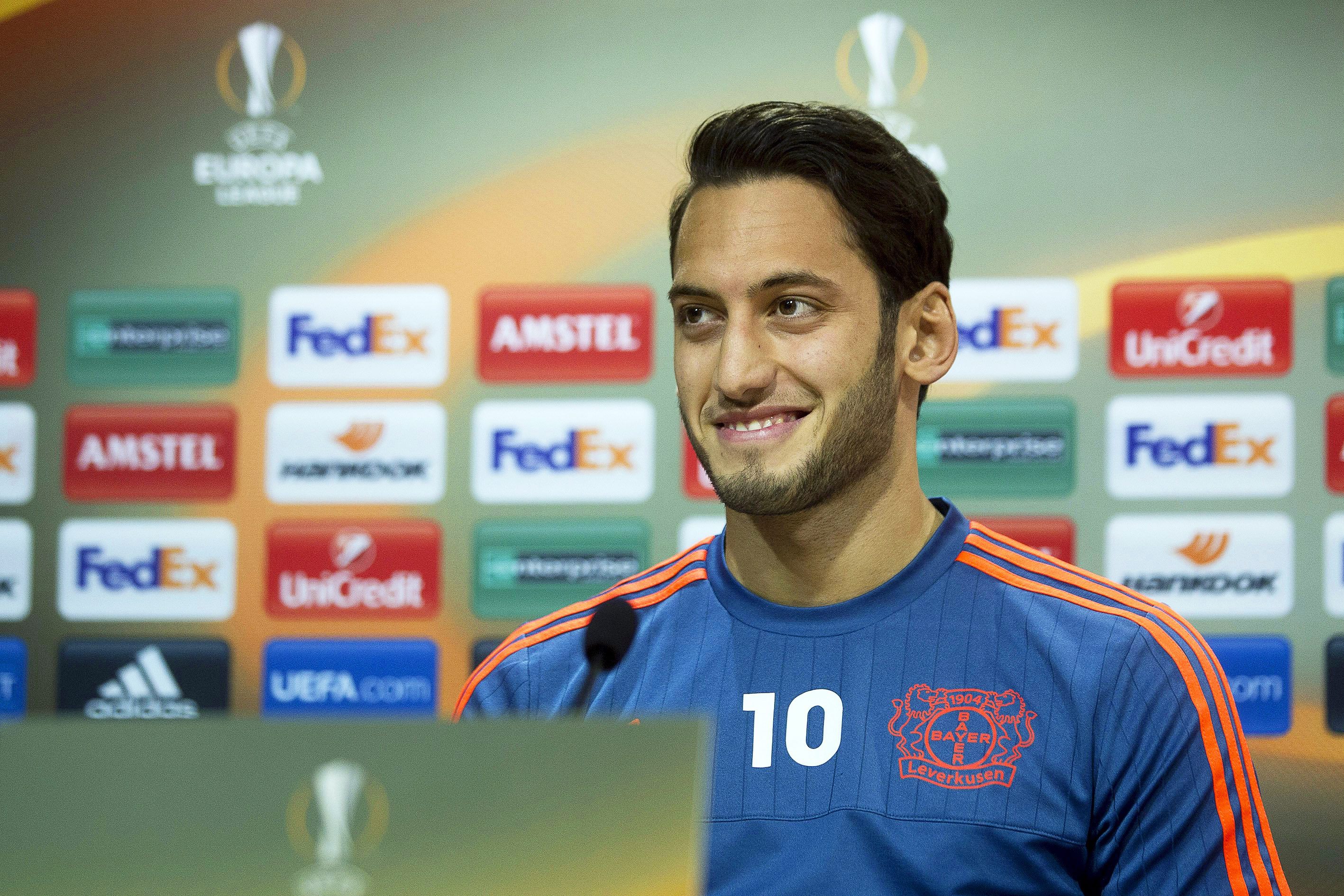 epa05203314 Bayer Leverkusen's Turkish forward Hakan Calhanoglu attends a press conference at El Madrigal stadium in Castellon, eastern Spain, 09 March 2016. Bayer Leverkusen will face Villarreal CF in the UEFA Europa League round of 16, first leg soccer match on 10 March 2016.  EPA/DOMENECH CASTELLO