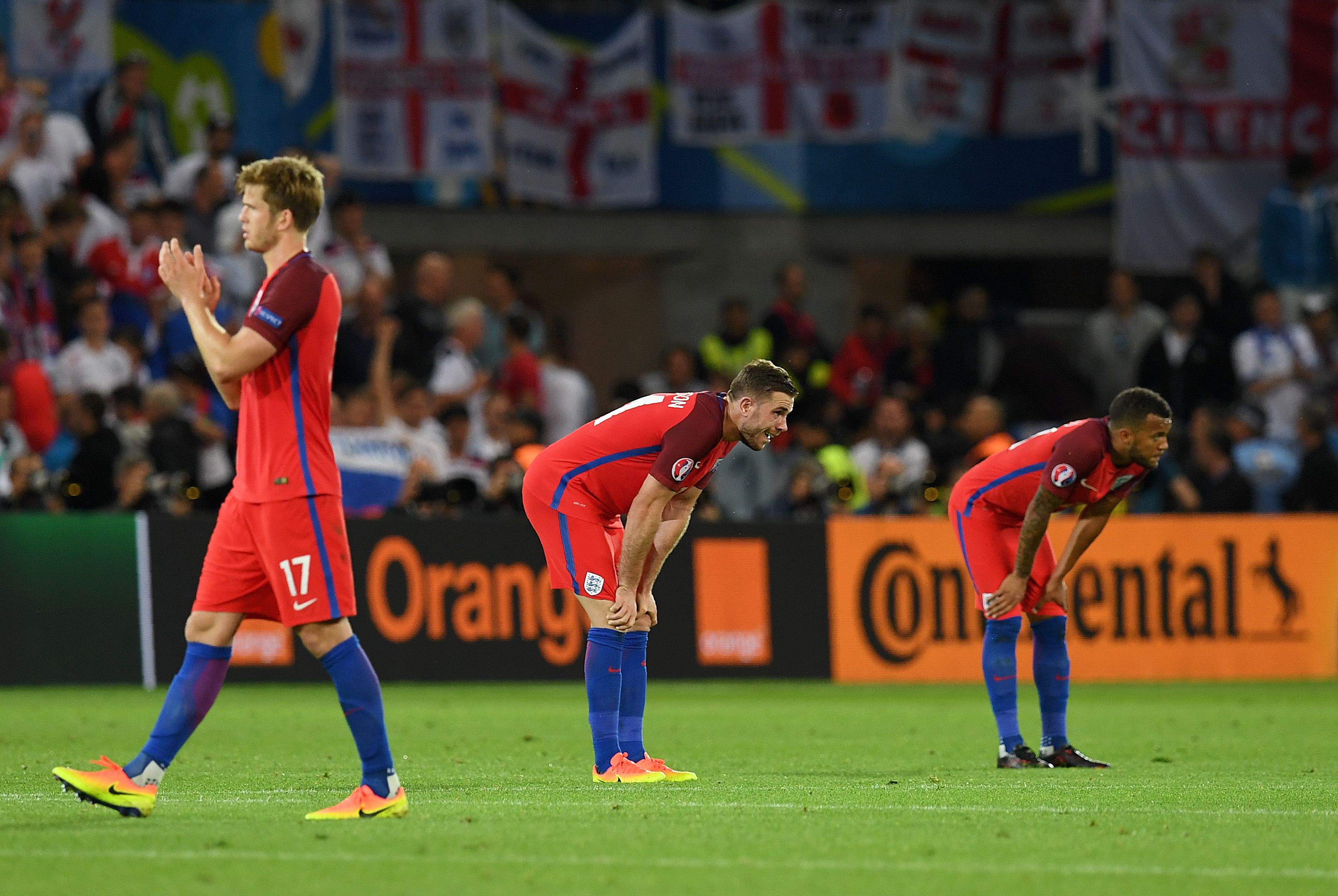 England's midfielder Eric Dier (L), England's midfielder Jordan Henderson and England's defender Ryan Bertrand react following their 0-0 draw during the Euro 2016 group B football match between Slovakia and England at the Geoffroy-Guichard stadium in Saint-Etienne on June 20, 2016. / AFP / PAUL ELLIS (Photo credit should read PAUL ELLIS/AFP/Getty Images)