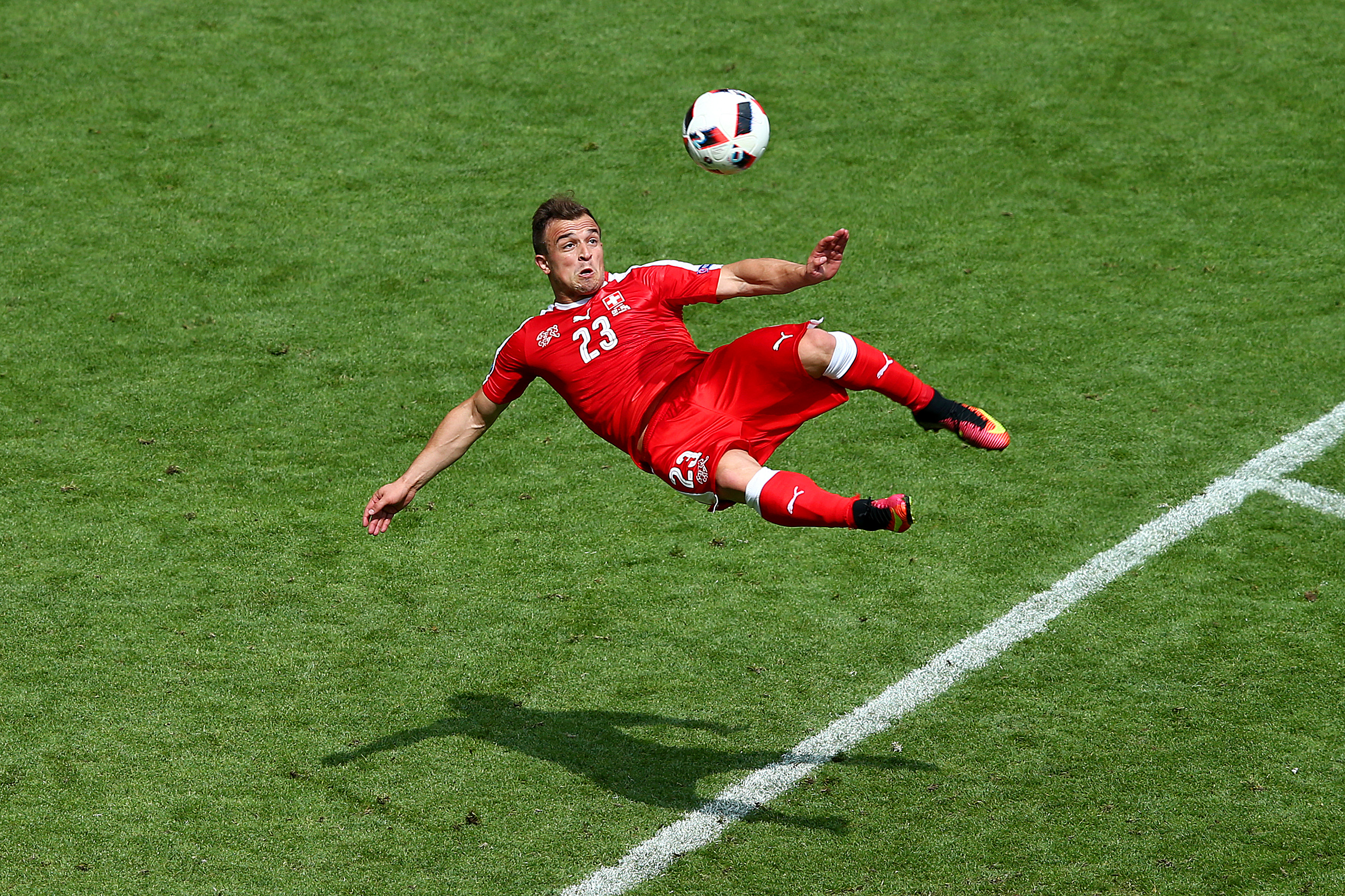 SAINT-ETIENNE, FRANCE - JUNE 25: Xherdan Shaqiri of Switzerland scores his team's first goal during the UEFA EURO 2016 round of 16 match between Switzerland and Poland at Stade Geoffroy-Guichard on June 25, 2016 in Saint-Etienne, France. (Photo by Alex Livesey/Getty Images)