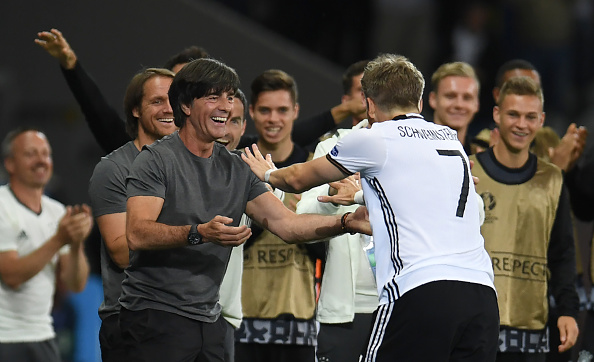 Germany's midfielder Bastian Schweinsteiger (R) celebrates with Germany's coach Joachim Loew (L) after scoring a goal during the Euro 2016 group C football match between Germany and Ukraine at the Stade Pierre Mauroy in Villeneuve-d'Ascq near Lille on June 12, 2016. / AFP / PATRIK STOLLARZ        (Photo credit should read PATRIK STOLLARZ/AFP/Getty Images)