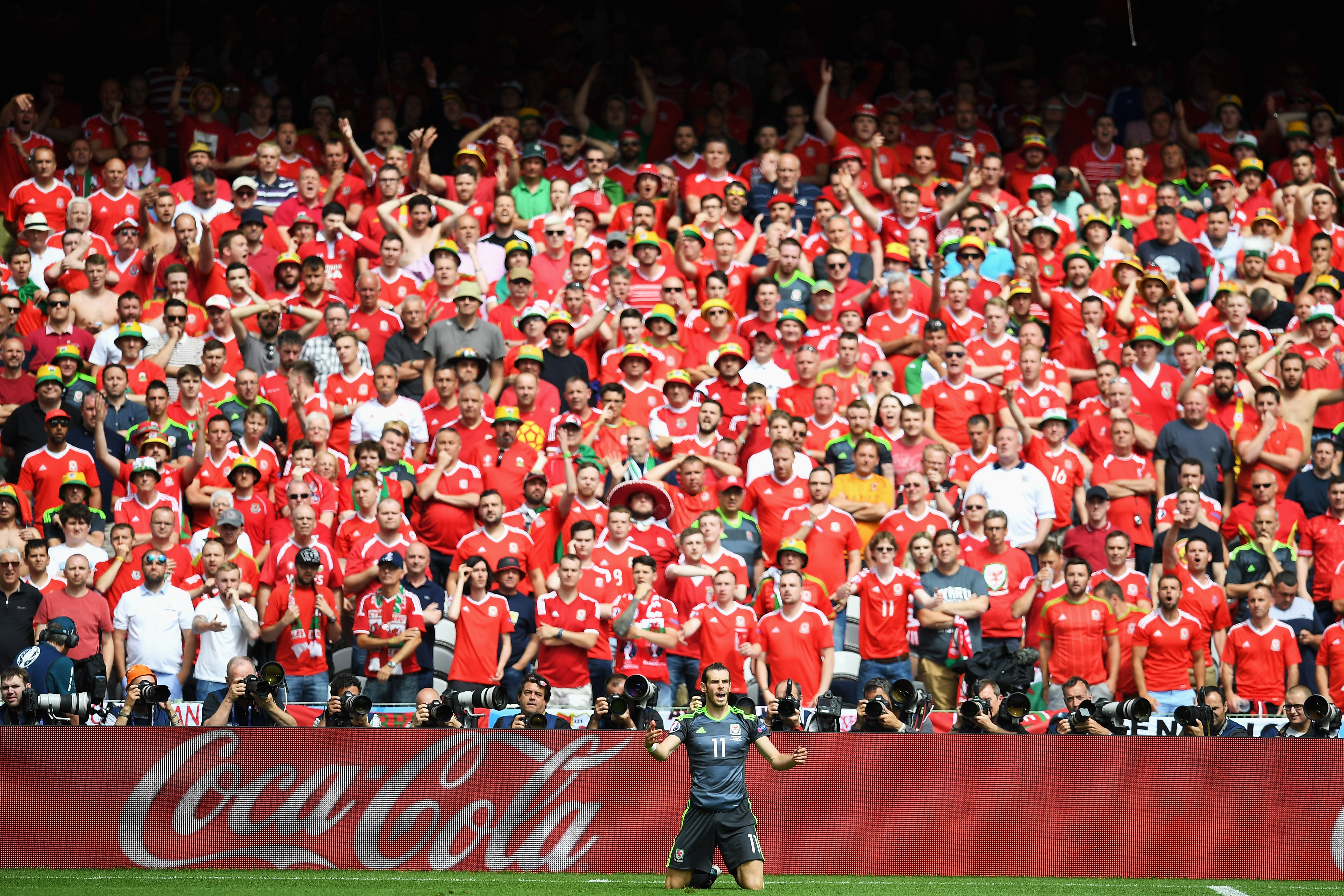 LENS, FRANCE - JUNE 16: Gareth Bale of Wales appeals to the referee in front of Wales supporters during the UEFA EURO 2016 Group B match between England and Wales at Stade Bollaert-Delelis on June 16, 2016 in Lens, France. (Photo by Matthias Hangst/Getty Images)