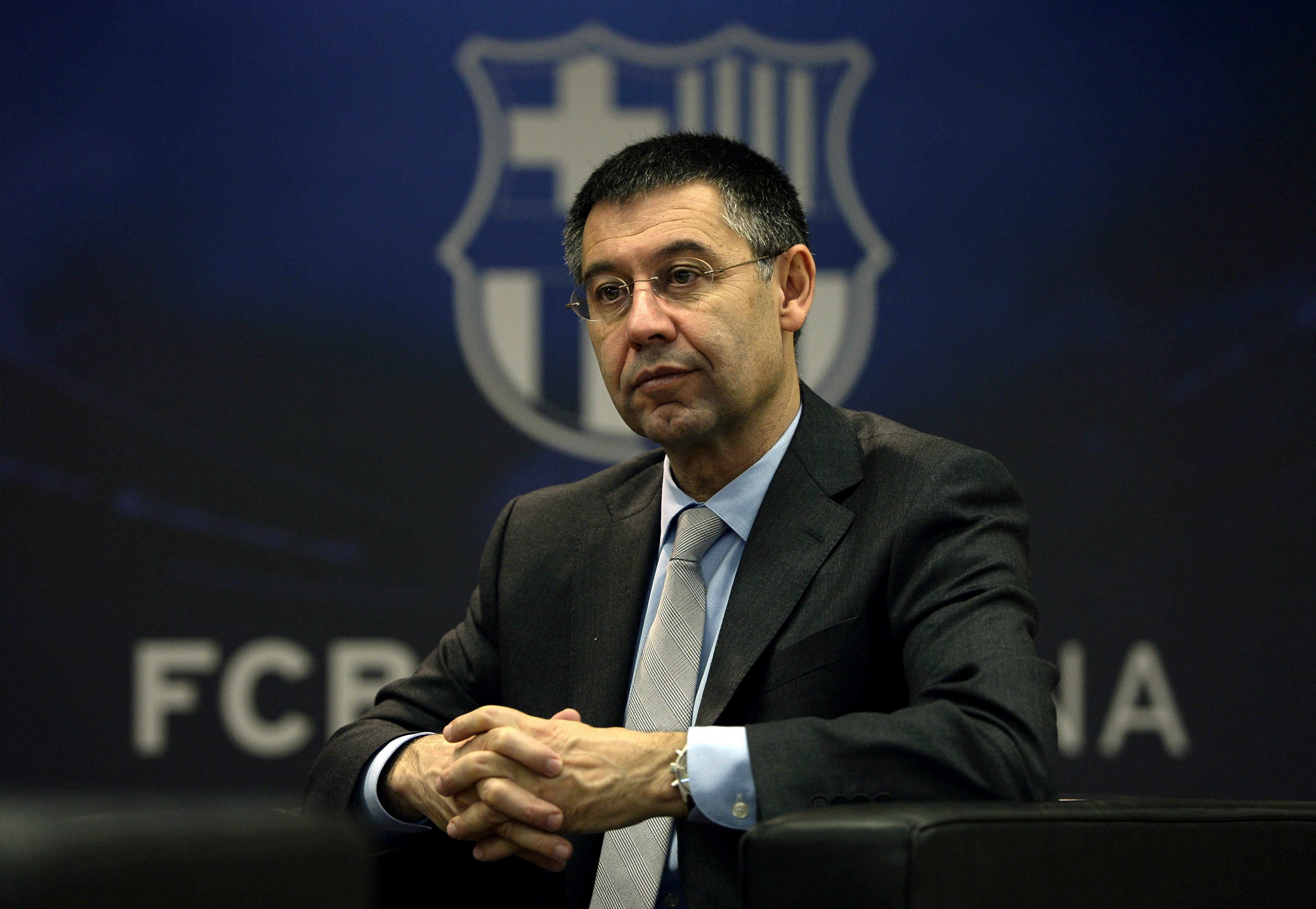 TO GO WITH AFP INTERVIEW
 FC Barcelona's president Josep Maria Bartomeu answers to AFP journalists during an interview at Camp Nou stadium in Barcelona on March 24, 2014. Bartomeu has insisted that Lionel Messi will become the world's highest paid footballer once negotiations over his new contract are finalised.     AFP PHOTO/ LLUIS GENE        (Photo credit should read LLUIS GENE/AFP/Getty Images)