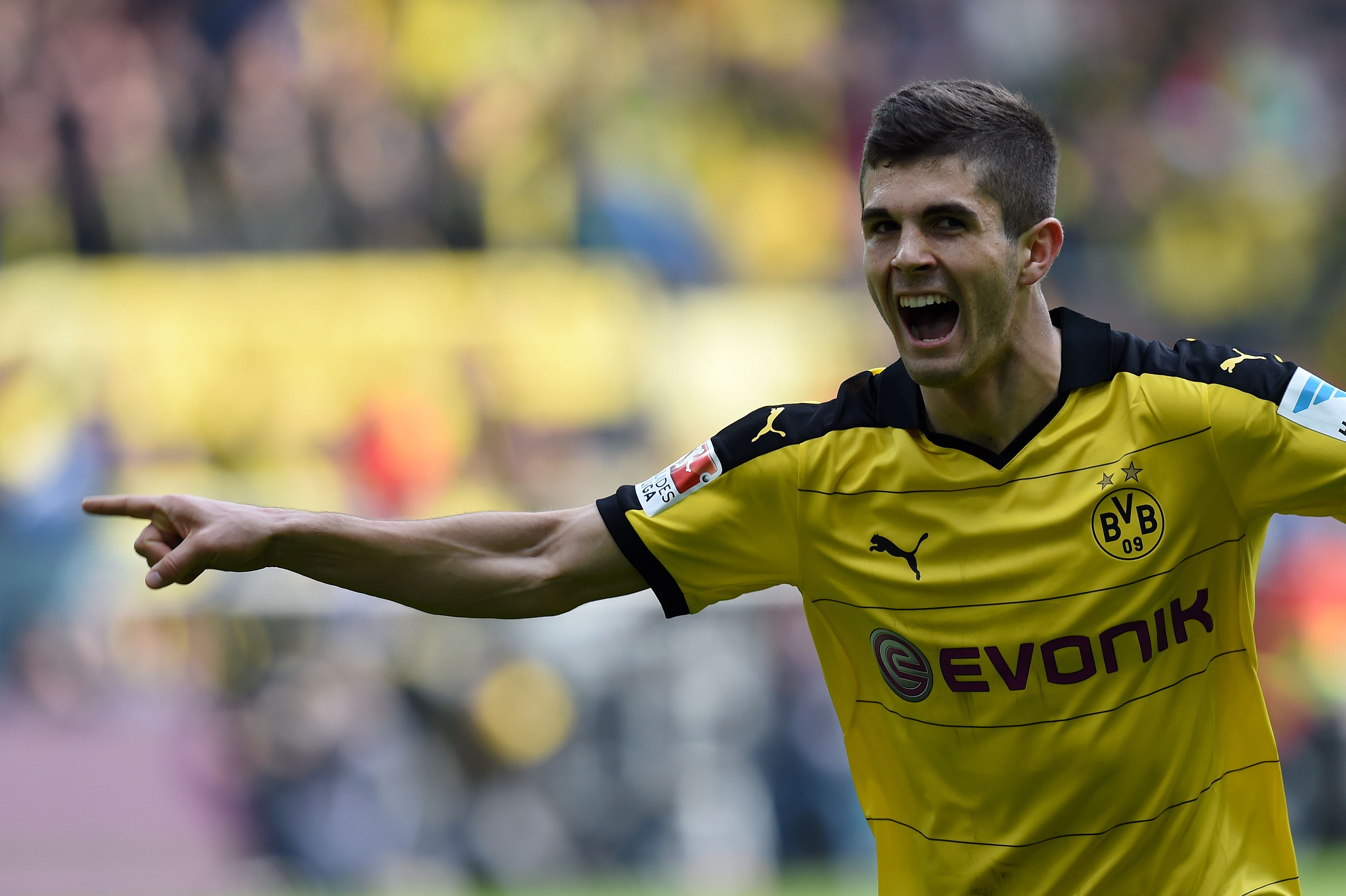 Dortmund's midfielder Christian Pulisic celebrates scoring the 1-0 goal during the German Bundesliga first division football match BVB Borussia Dortmund vs Hamburg SV in Dortmund, western Germany, on April 17, 2016. 

 / AFP / PATRIK STOLLARZ / RESTRICTIONS: DURING MATCH TIME: DFL RULES TO LIMIT THE ONLINE USAGE TO 15 PICTURES PER MATCH AND FORBID IMAGE SEQUENCES TO SIMULATE VIDEO. == RESTRICTED TO EDITORIAL USE == FOR FURTHER QUERIES PLEASE CONTACT DFL DIRECTLY AT + 49 69 650050
        (Photo credit should read PATRIK STOLLARZ/AFP/Getty Images)