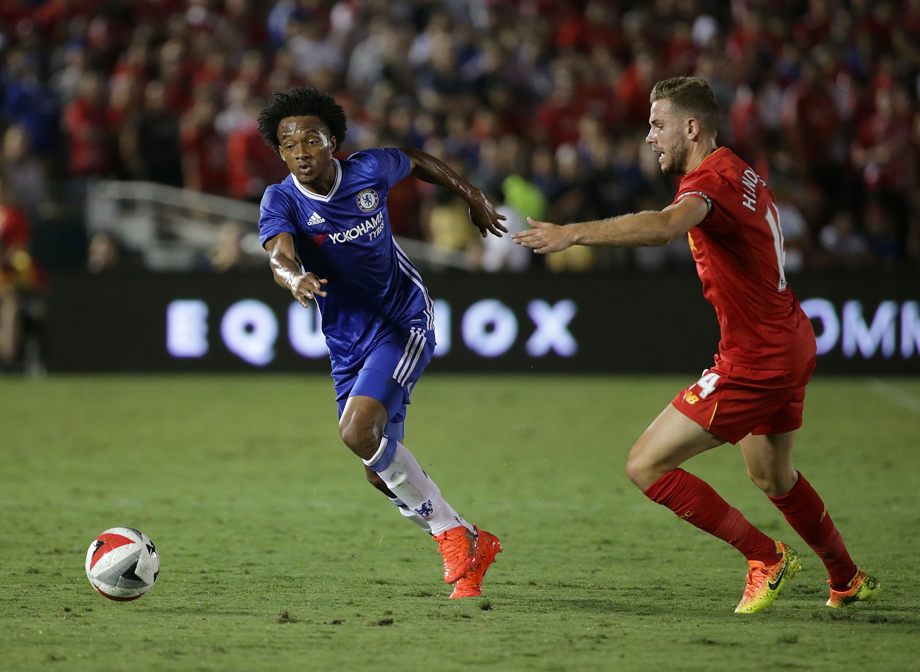 PASADENA, CA - JULY 27:  Juan Cuadrado #17 of Chelsea is defended by Jordan Henderson #14 of Liverpool during the 2016 International Champions Cup at Rose Bowl on July 27, 2016 in Pasadena, California.  (Photo by Jeff Gross/Getty Images)