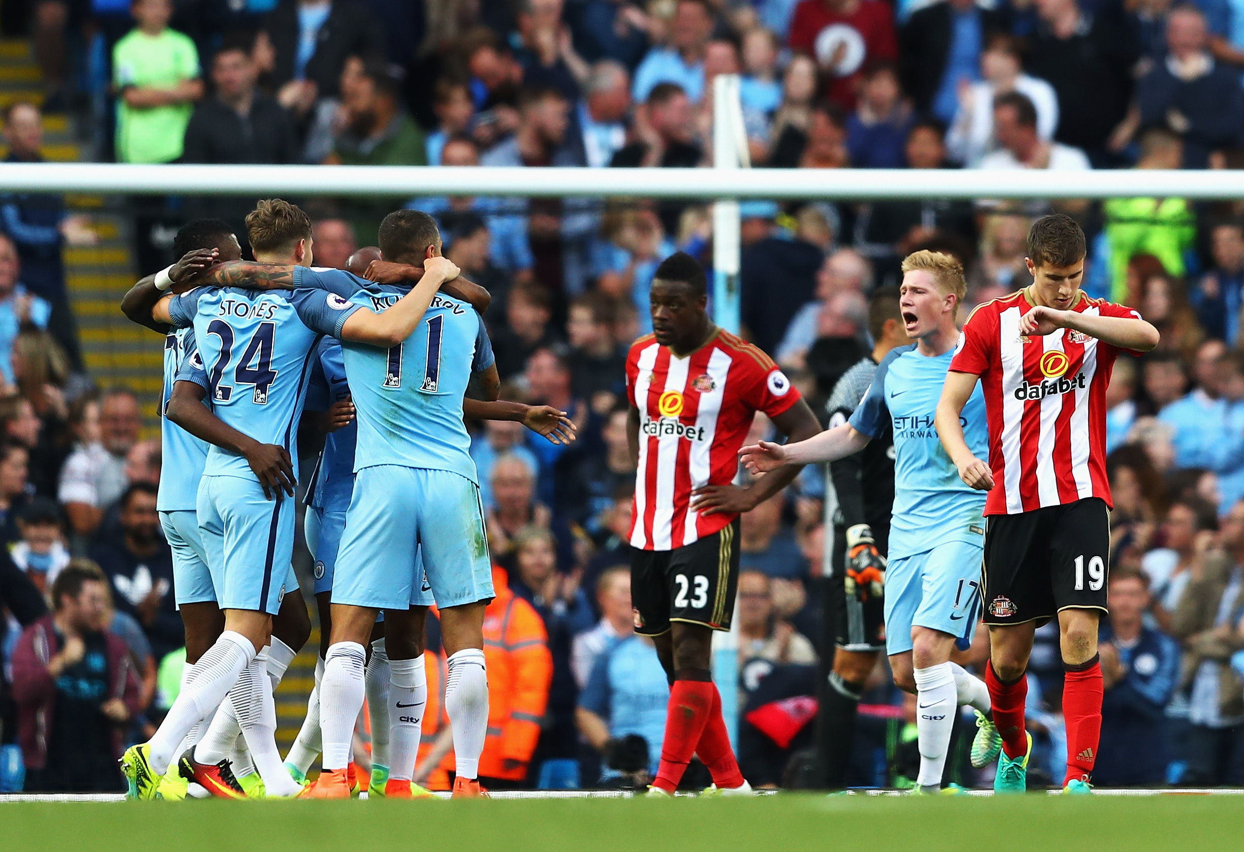 MANCHESTER, ENGLAND - AUGUST 13: Manchester City players celebrate after Paddy McNair of Sunderland scored a own goal to score Manchester City's second goal during the Premier League match between Manchester City and Sunderland at Etihad Stadium on August 13, 2016 in Manchester, England. (Photo by Michael Steele/Getty Images)