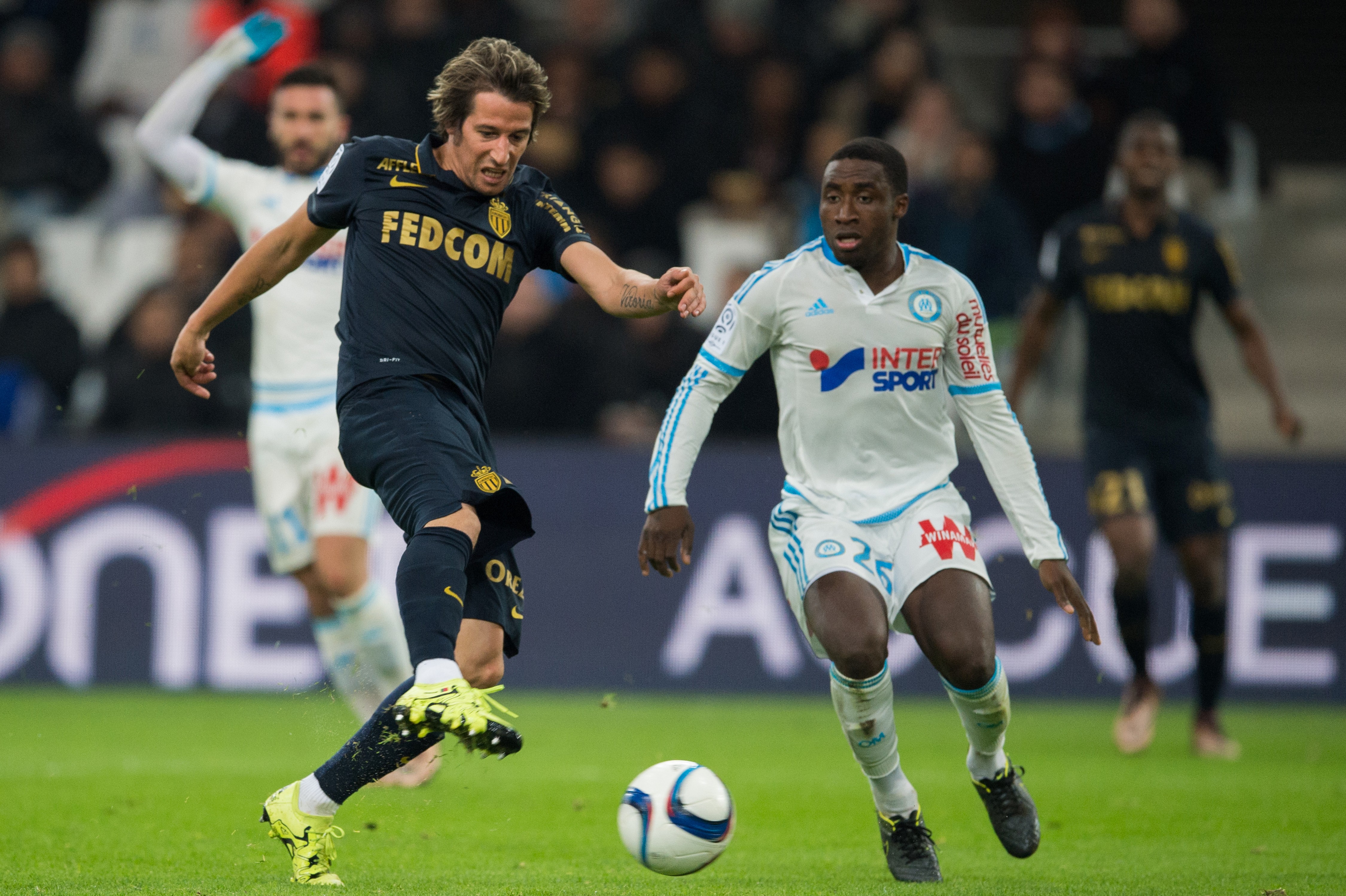 Marseille's Ivorian defender Brice Djadjedje (R) vies with Monaco's Portuguese defender Fabio Coentrao during the French L1 football match between Olympique de Marseille and AS Monaco on November 29, 2015 at the Velodrome stadium in Marseille, southern France. AFP PHOTO / BERTRAND LANGLOIS / AFP / BERTRAND LANGLOIS (Photo credit should read BERTRAND LANGLOIS/AFP/Getty Images)