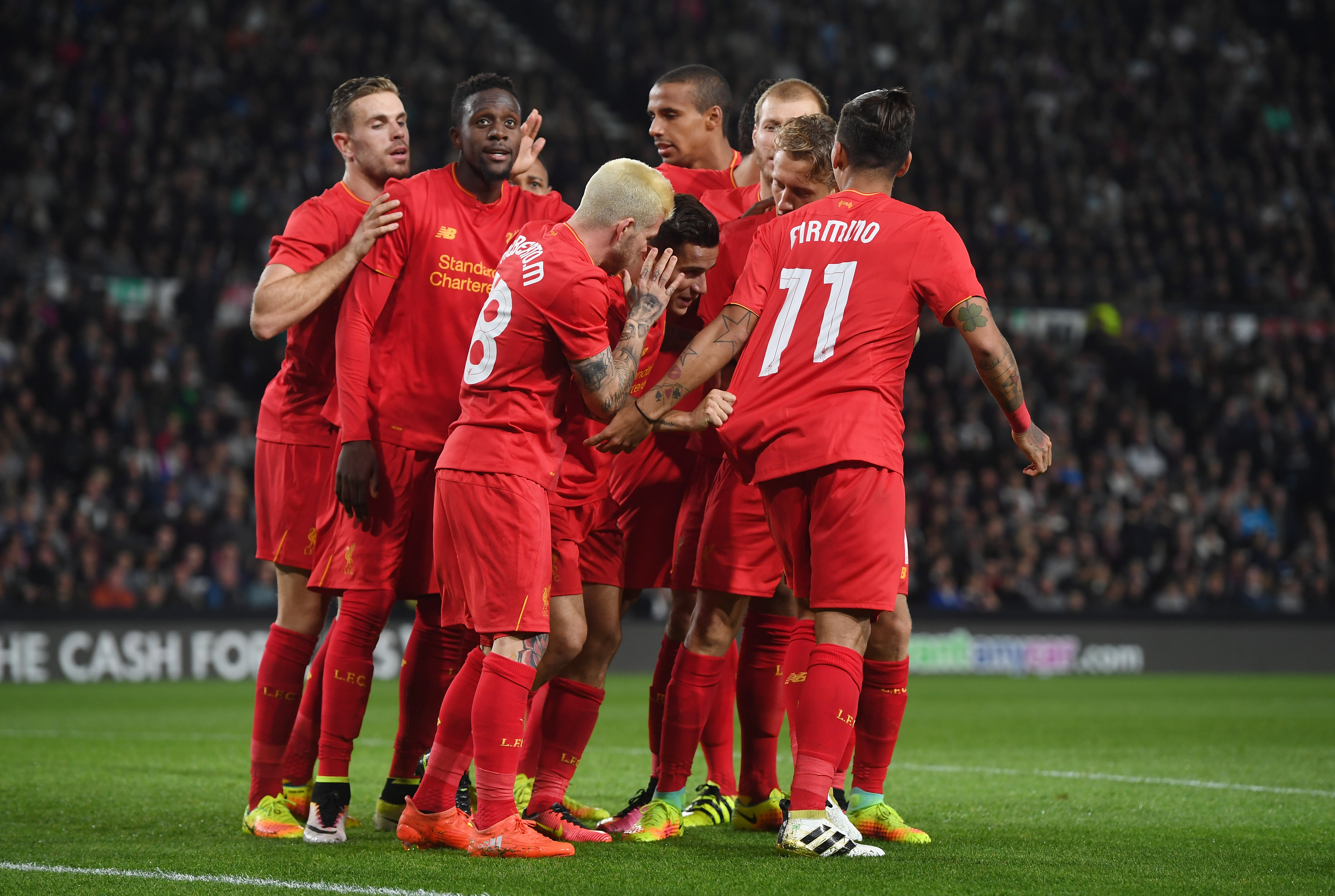 DERBY, ENGLAND - SEPTEMBER 20:  Philippe Coutinho of Liverpool celebrates scoring his team's second goal with team mates during the EFL Cup Third Round match between Derby County and Liverpool at iPro Stadium on September 20, 2016 in Derby, England.  (Photo by Gareth Copley/Getty Images)