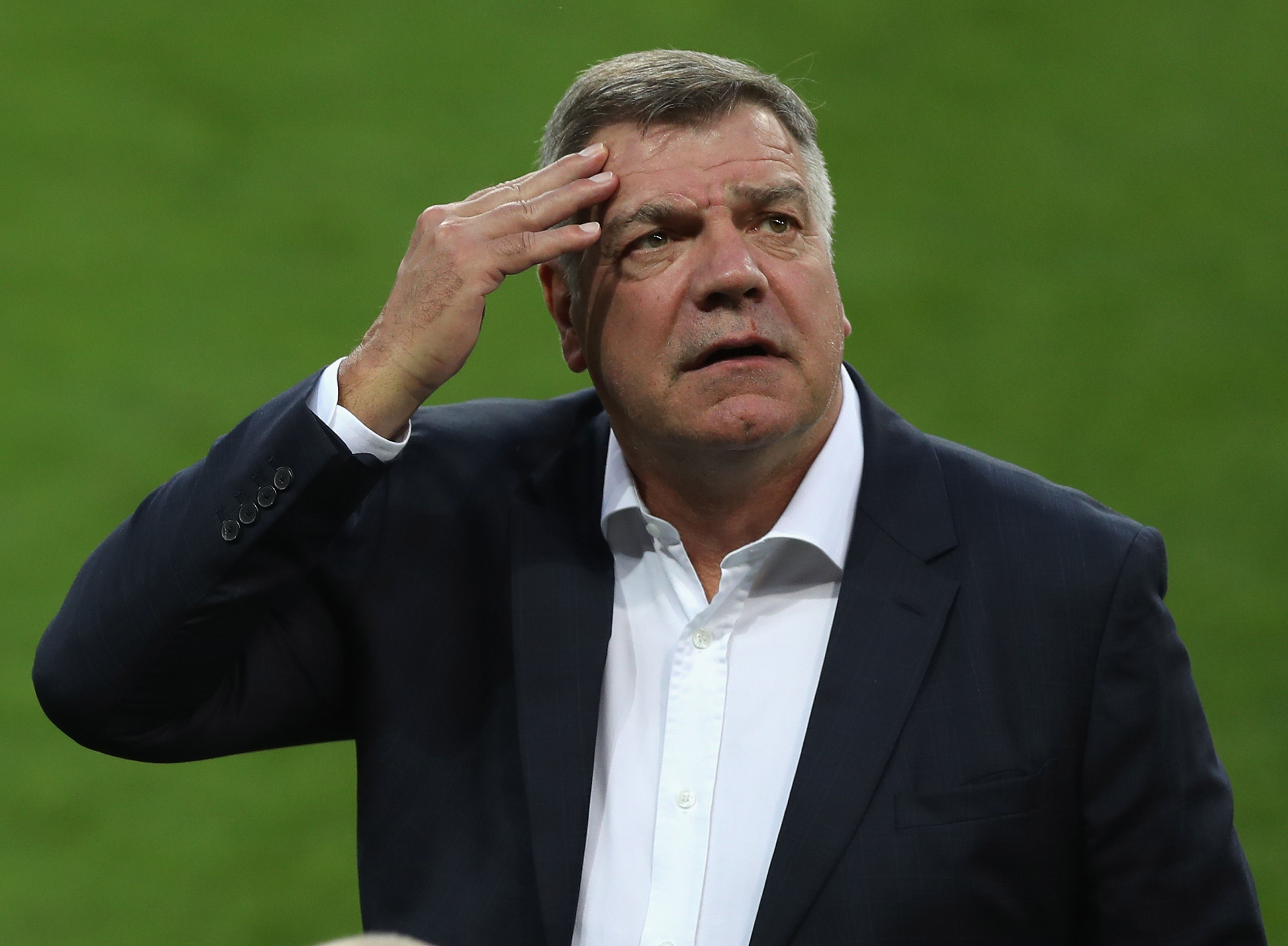 TRNAVA, SLOVAKIA - SEPTEMBER 03: Manager Sam Allardyce rubs his forehead as he inspects the pitch prior to the FIFA World Cup Qualifying Group F match against Slovakia at City Arena on September 3, 2016 in Trnava, Slovakia. (Photo by Christopher Lee/Getty Images)