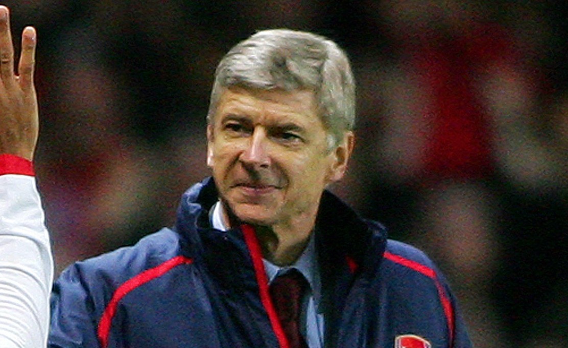 Arsenal's Captain, Frenchman Thierry Henry (L) celebrates with countryman manager Arsene Wenger (R) after scoring from a penalty shot during their Premiership match against Charlton at home to Arsenal, 02 January 2006. (Photo by Carl de Souza/AFP/Getty Images)