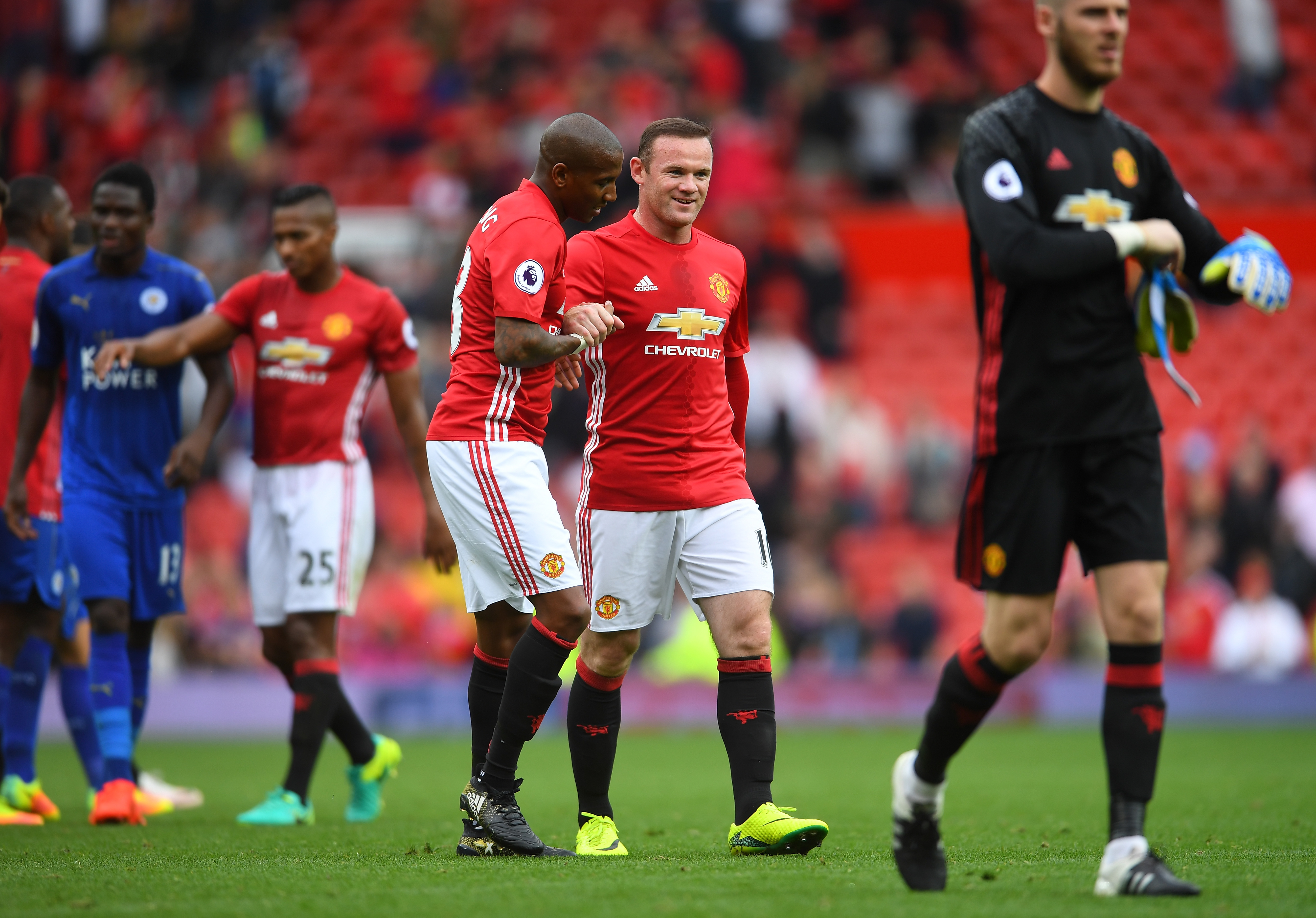MANCHESTER, ENGLAND - SEPTEMBER 24: Ashley Young of Manchester United (L) and Wayne Rooney of Manchester United (R) celebrate their sides win after the final whistle  during the Premier League match between Manchester United and Leicester City at Old Trafford on September 24, 2016 in Manchester, England.  (Photo by Laurence Griffiths/Getty Images)