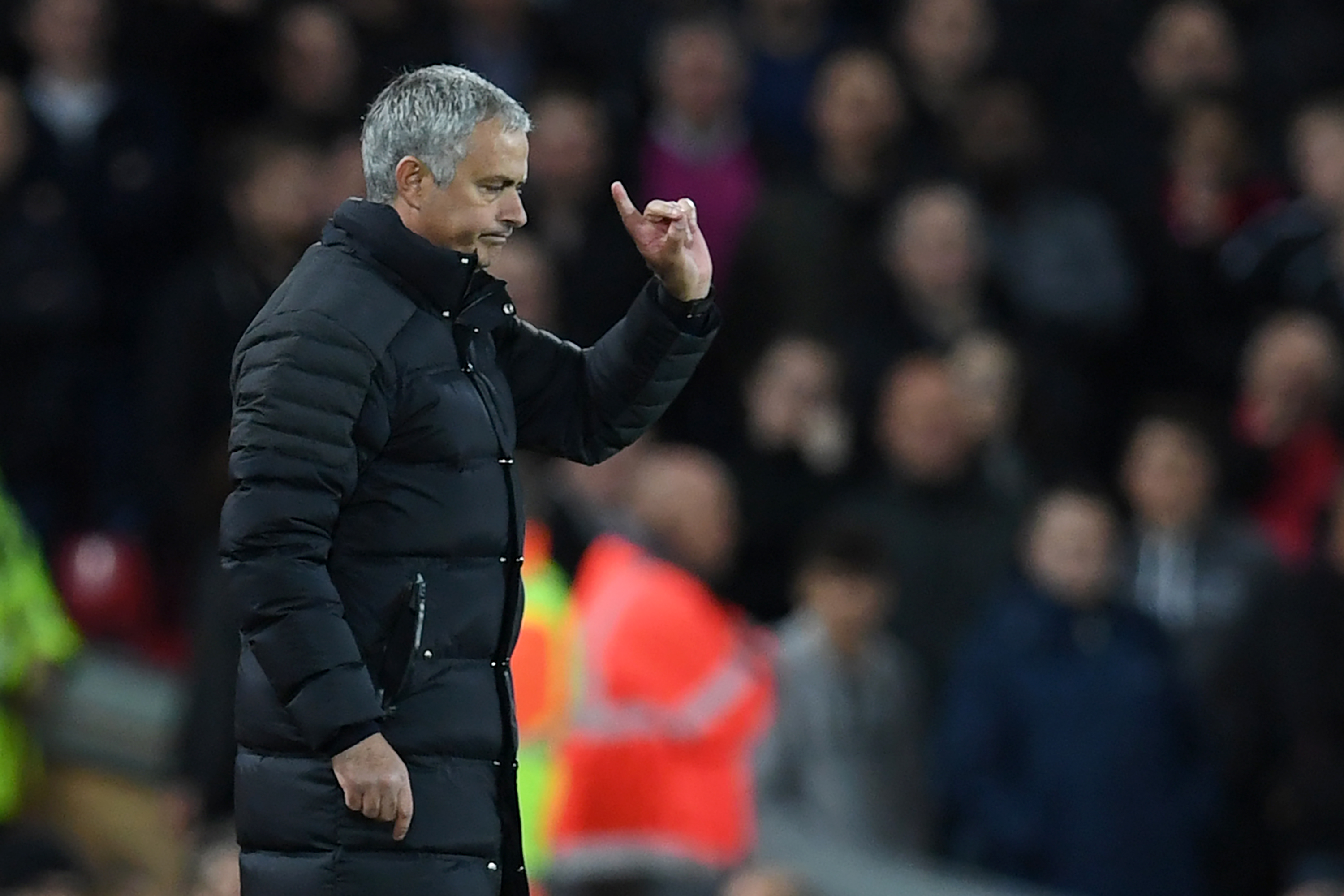 Manchester United's Portuguese manager Jose Mourinho gestures to the referee during the English Premier League football match between Liverpool and Manchester United at Anfield in Liverpool, north west England on October 17, 2016. / AFP / Paul ELLIS / RESTRICTED TO EDITORIAL USE. No use with unauthorized audio, video, data, fixture lists, club/league logos or 'live' services. Online in-match use limited to 75 images, no video emulation. No use in betting, games or single club/league/player publications.  /         (Photo credit should read PAUL ELLIS/AFP/Getty Images)