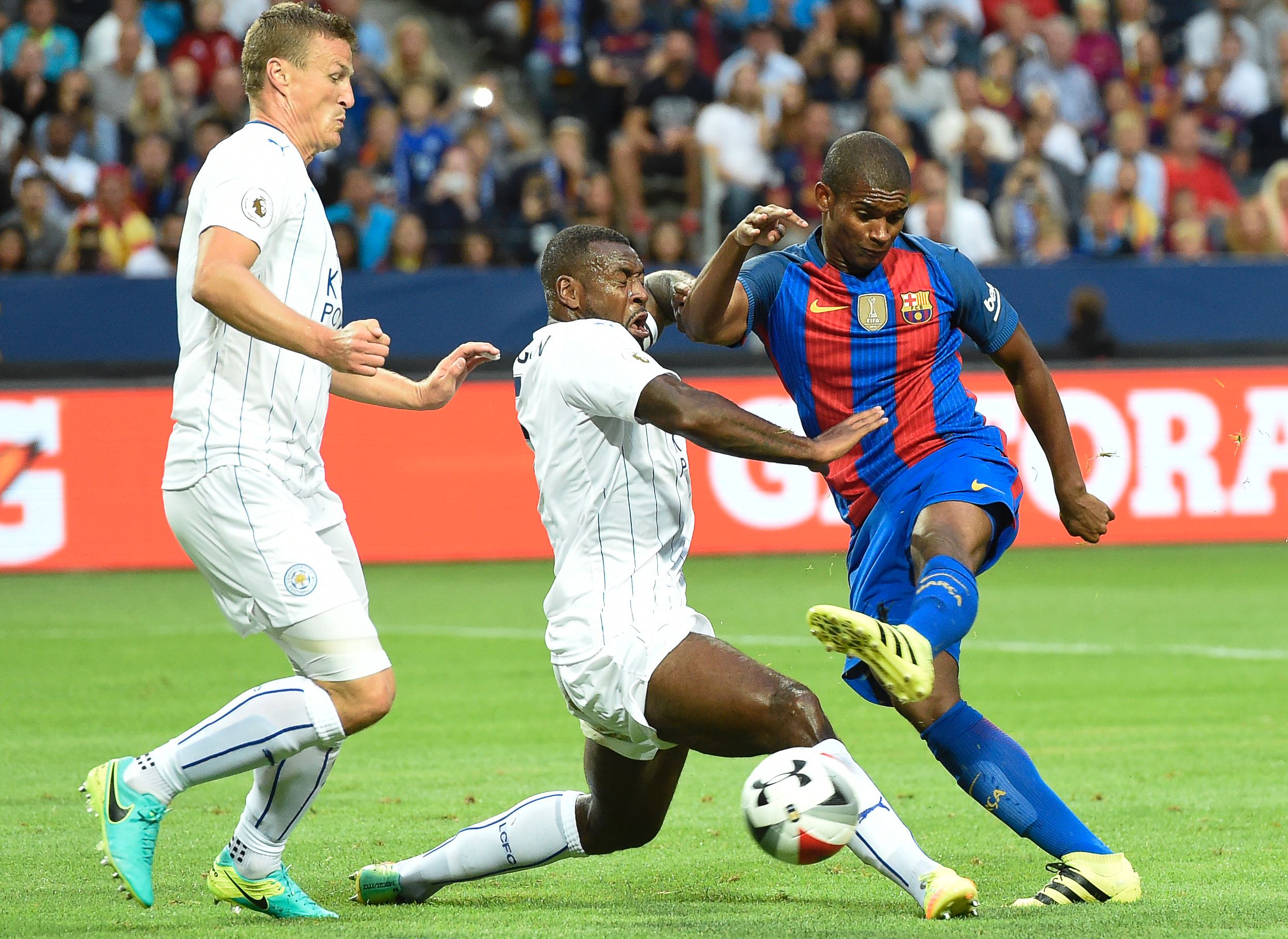 Barcelona's Brazilian defender Marlon Santos (R) vies with Leicester's English defender Danny Simpson (C) during the 2016 International Champions Cup friendly football match between FC Barcelona and Leicester City at Friends Arena on August 3, 2016 in Solna, Sweden. (Photo by Jonathan Nackstrand/AFP/Getty Images)