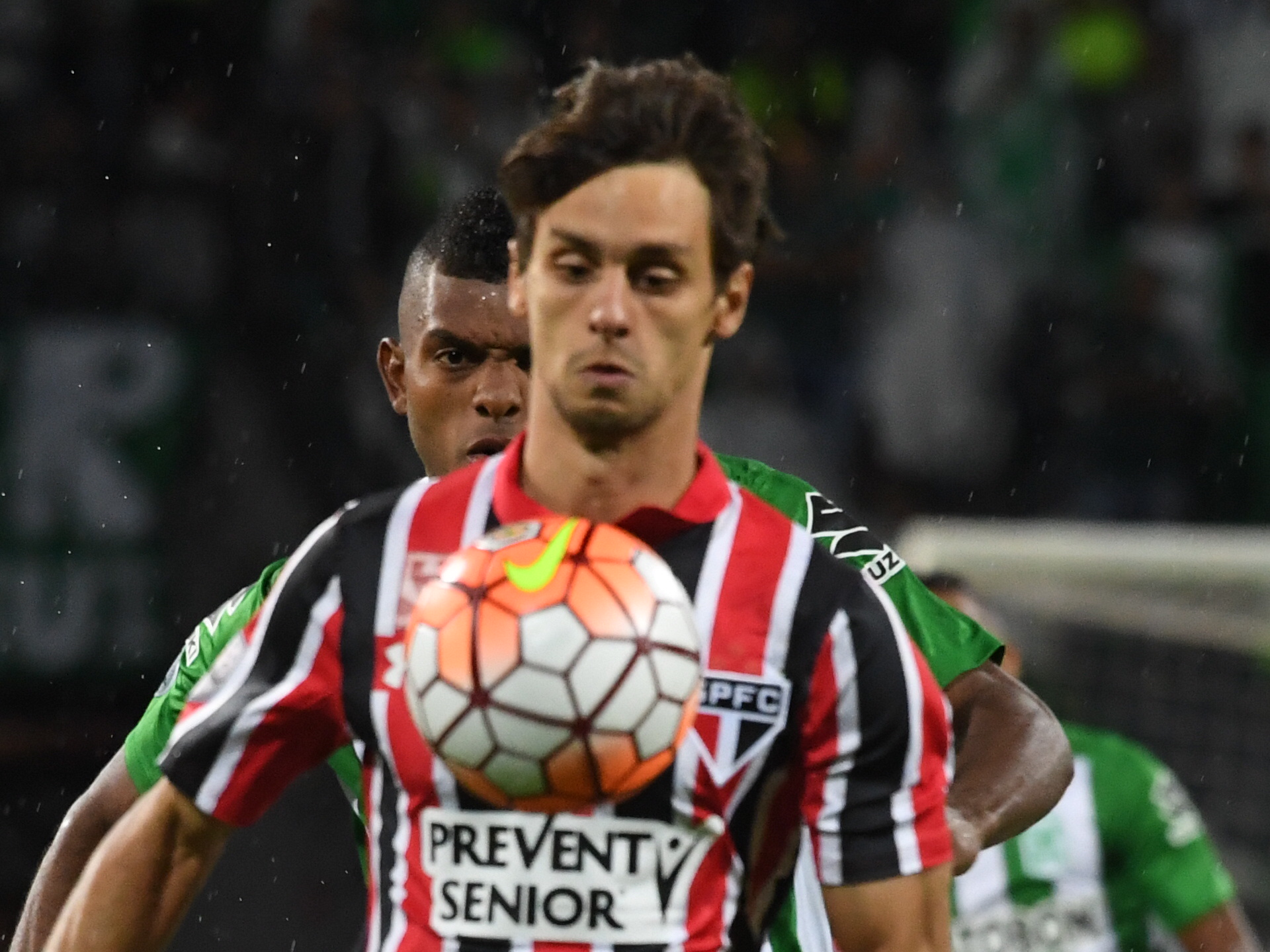 Brazils Sao Paulo player Rodrigo Caio (front) and Colombia's Atletico Nacional player Miguel Borja vie for the ball during their 2016 Copa Libertadores semifinal football match at Atanasio Girardot stadium, in Medellin, Antioquia department, Colombia, on July 13, 2016. / AFP / Luis Acosta        (Photo credit should read LUIS ACOSTA/AFP/Getty Images)