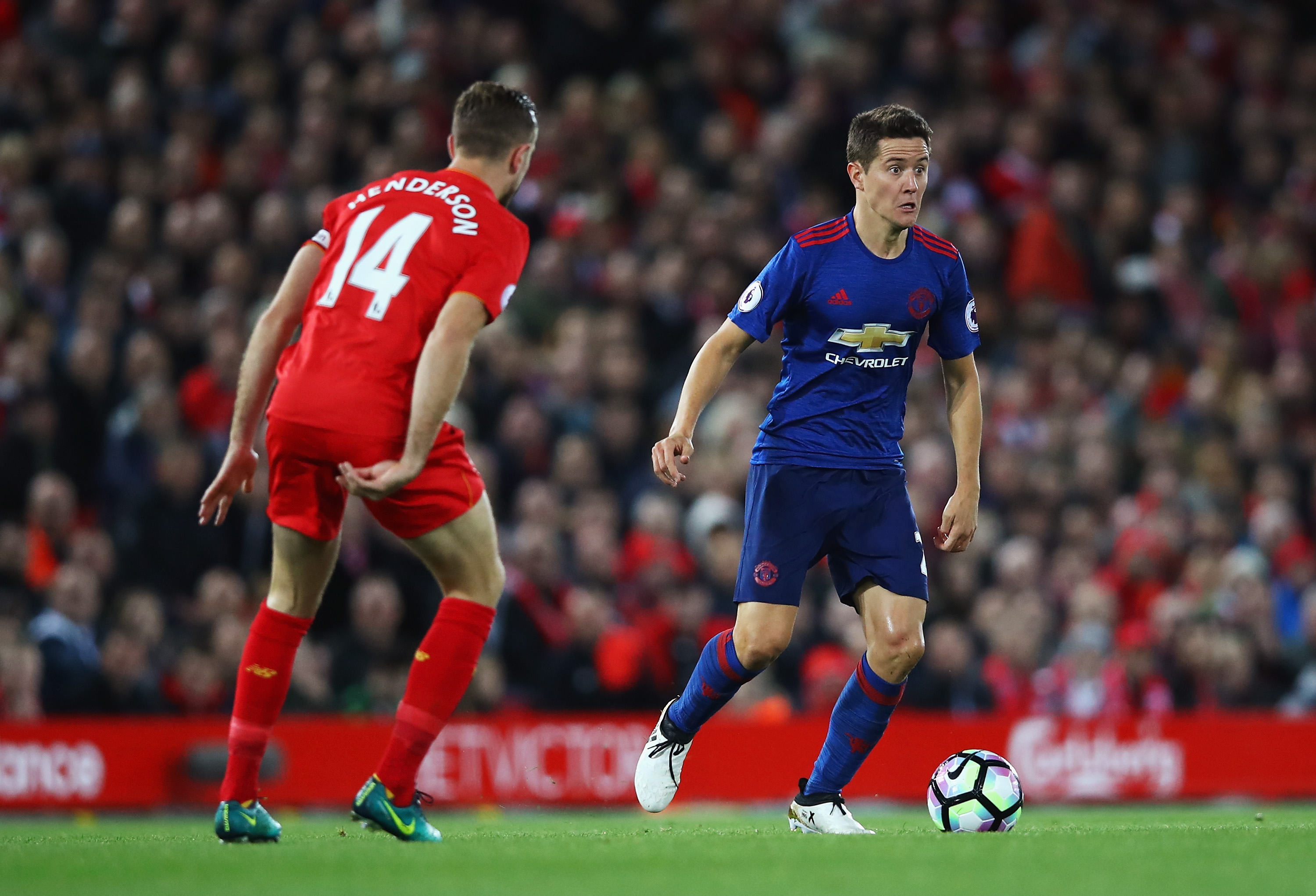 LIVERPOOL, ENGLAND - OCTOBER 17: Ander Herrera of Manchester United is closed down by Jordan Henderson of Liverpool during the Premier League match between Liverpool and Manchester United at Anfield on October 17, 2016 in Liverpool, England.  (Photo by Clive Brunskill/Getty Images)