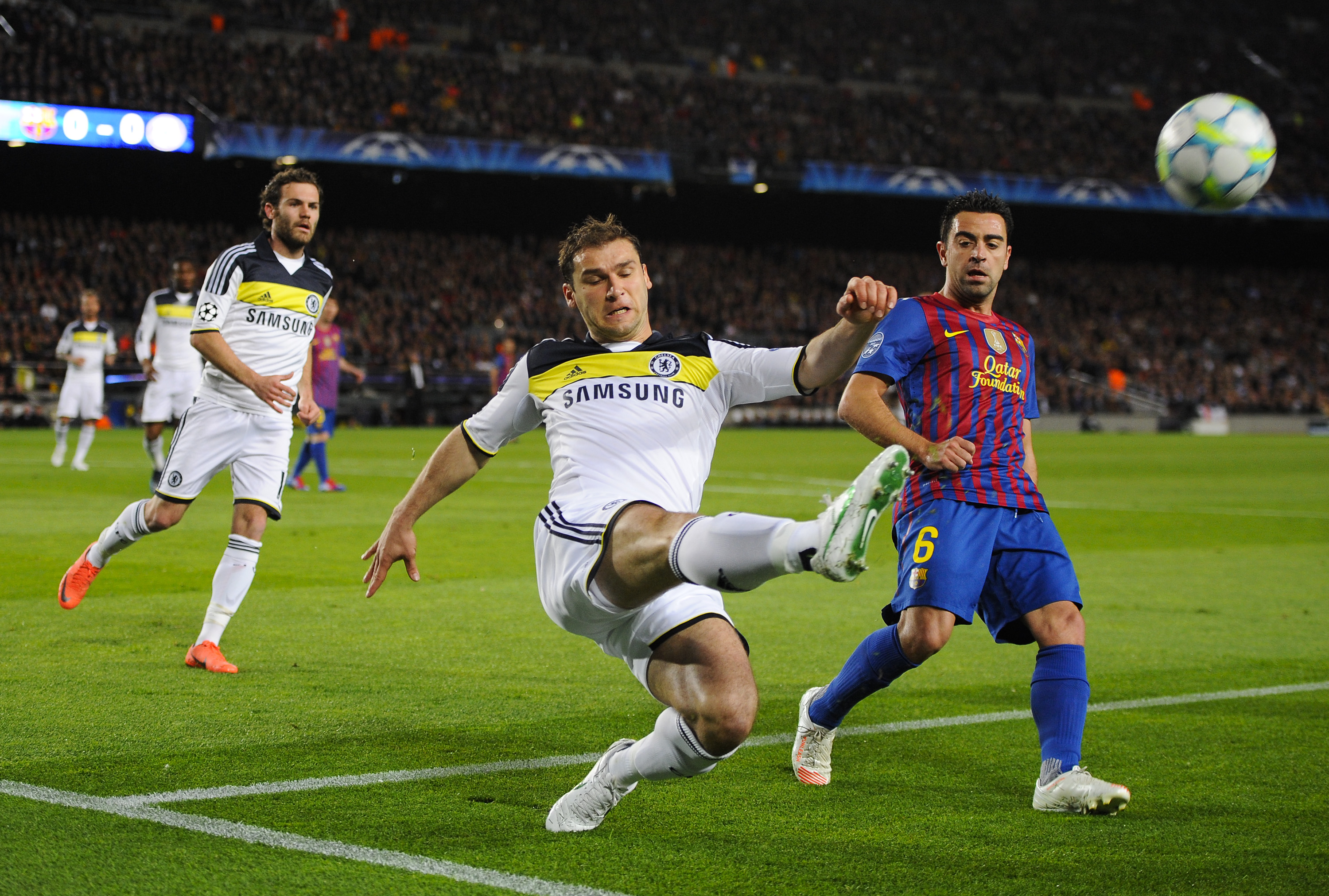 BARCELONA, SPAIN - APRIL 24:  Branislav Ivanovic of Chelsea (C) in action against Xavi Hernandez of FC Barcelona during the UEFA Champions League Semi Final, second leg match between FC Barcelona and Chelsea FC at Camp Nou on April 24, 2012 in Barcelona, Spain.  (Photo by David Ramos/Getty Images)
