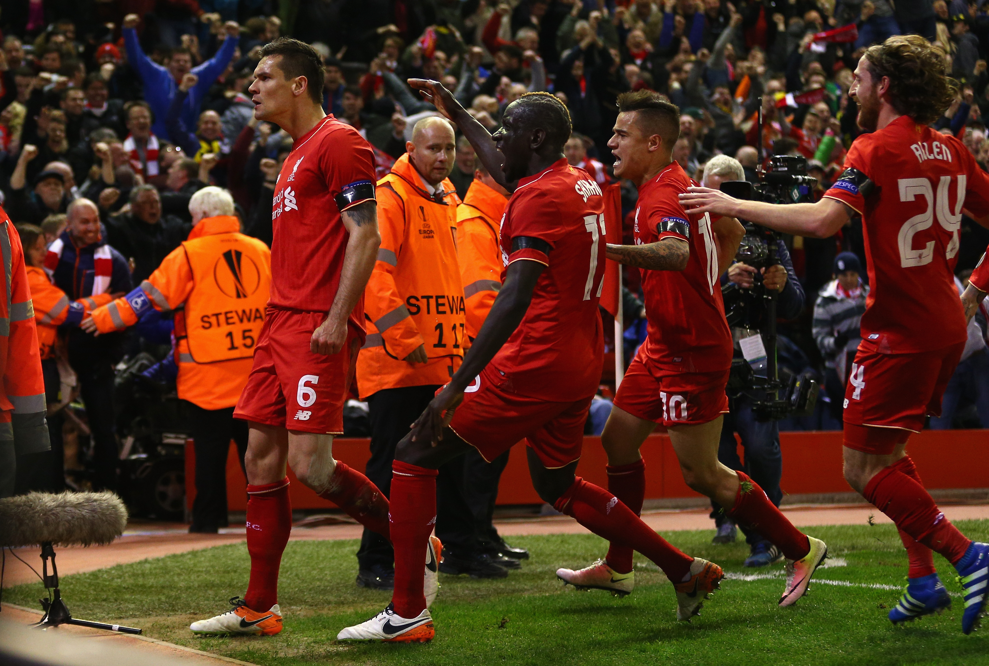LIVERPOOL, ENGLAND - APRIL 14: Dejan Lovren of Liverpool celebrates scoring his team's fourth goal with his team mates during the UEFA Europa League quarter final second leg match between Liverpool and Borussia Dortmund at Anfield on April 14, 2016 in Liverpool, United Kingdom. (Photo by Clive Brunskill/Getty Images)