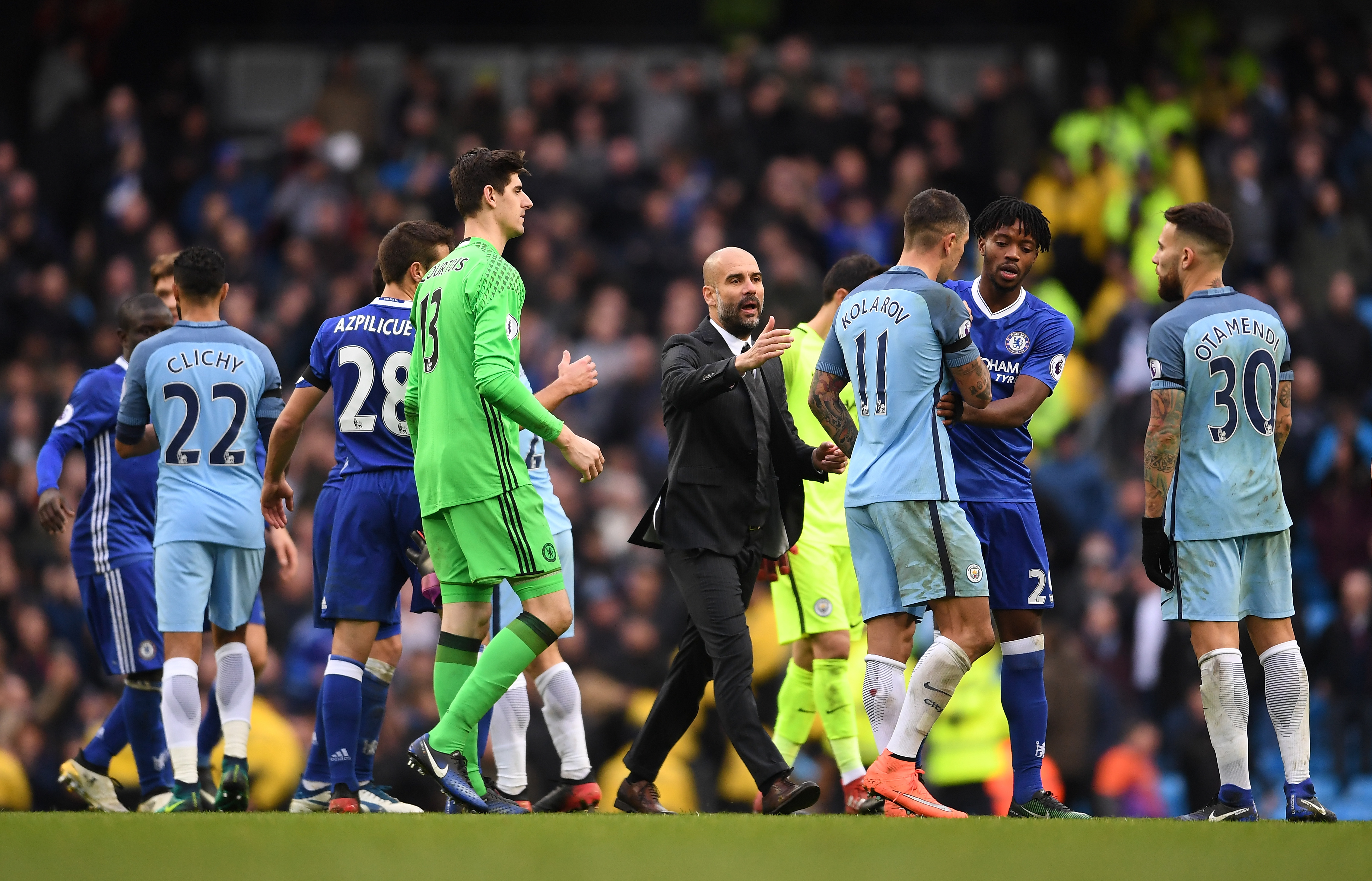 MANCHESTER, ENGLAND - DECEMBER 03:  Josep Guardiola tries to calm down players after David Luiz of Chelsea is fouled by Sergio Aguero of Manchester City during the Premier League match between Manchester City and Chelsea at Etihad Stadium on December 3, 2016 in Manchester, England.  (Photo by Laurence Griffiths/Getty Images)