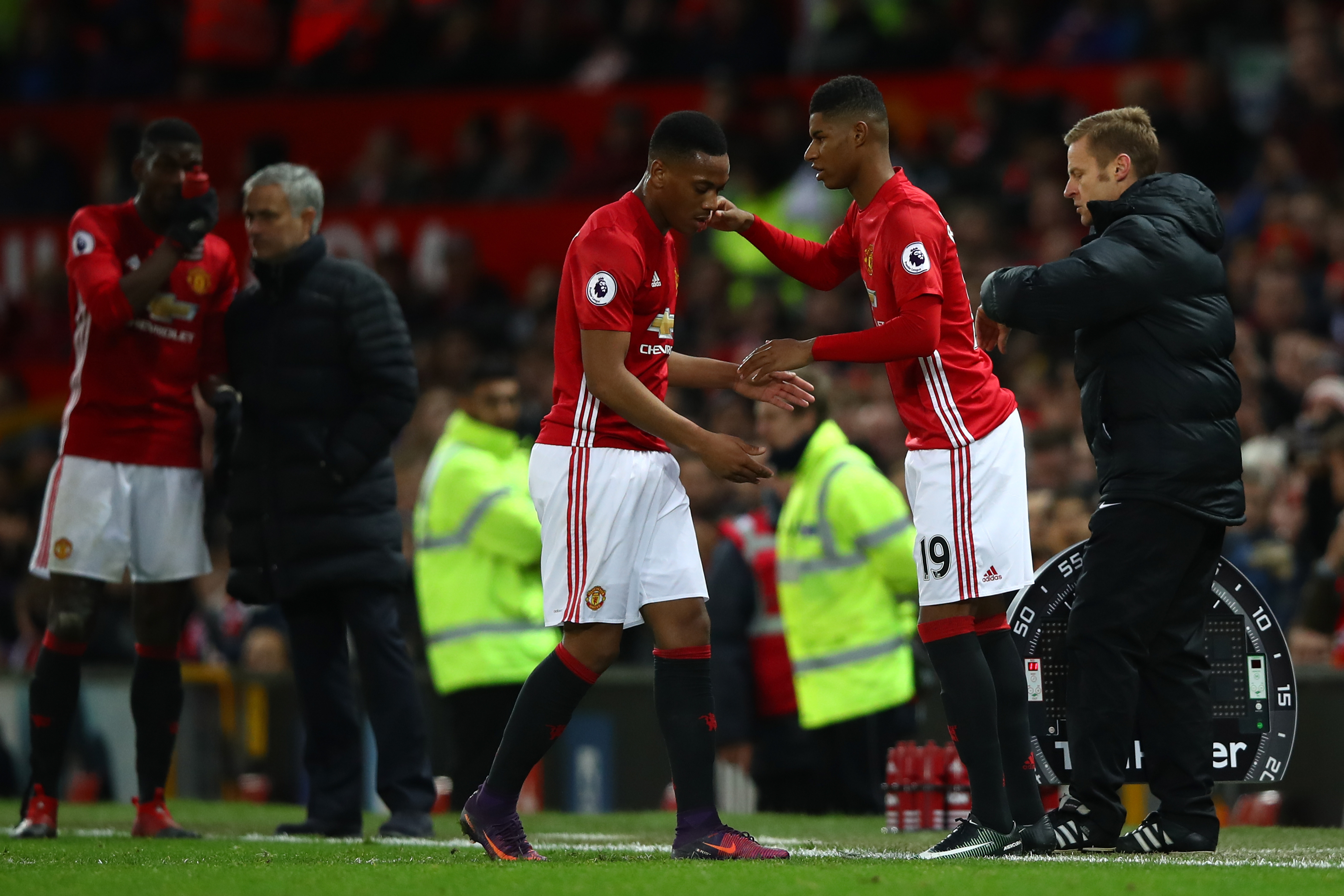 MANCHESTER, ENGLAND - DECEMBER 11: Marcus Rashford of Manchester United shakes hands with Anthony Martial during the Premier League match between Manchester United and Tottenham Hotspur at Old Trafford on December 11, 2016 in Manchester, England. (Photo by Clive Brunskill/Getty Images)