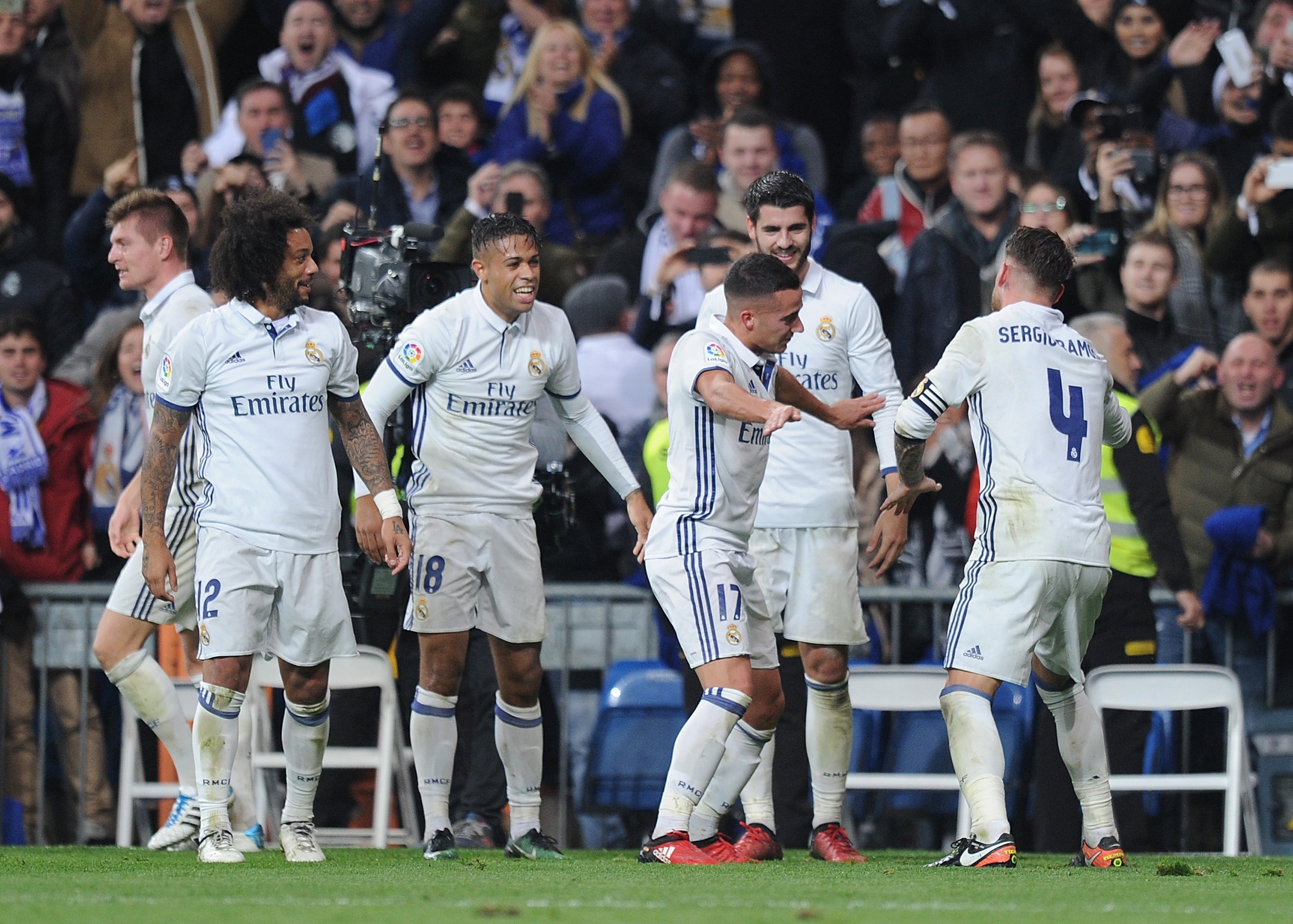 MADRID, SPAIN - DECEMBER 10: Sergio Ramos of Real Madrid celebrates with teammates after scoring their 3rd goal during the La Liga match between Real Madrid CF and RC Deportivo La Coruna at Estadio Santiago Bernabeu on December 10, 2016 in Madrid, Spain. (Photo by Denis Doyle/Getty Images)