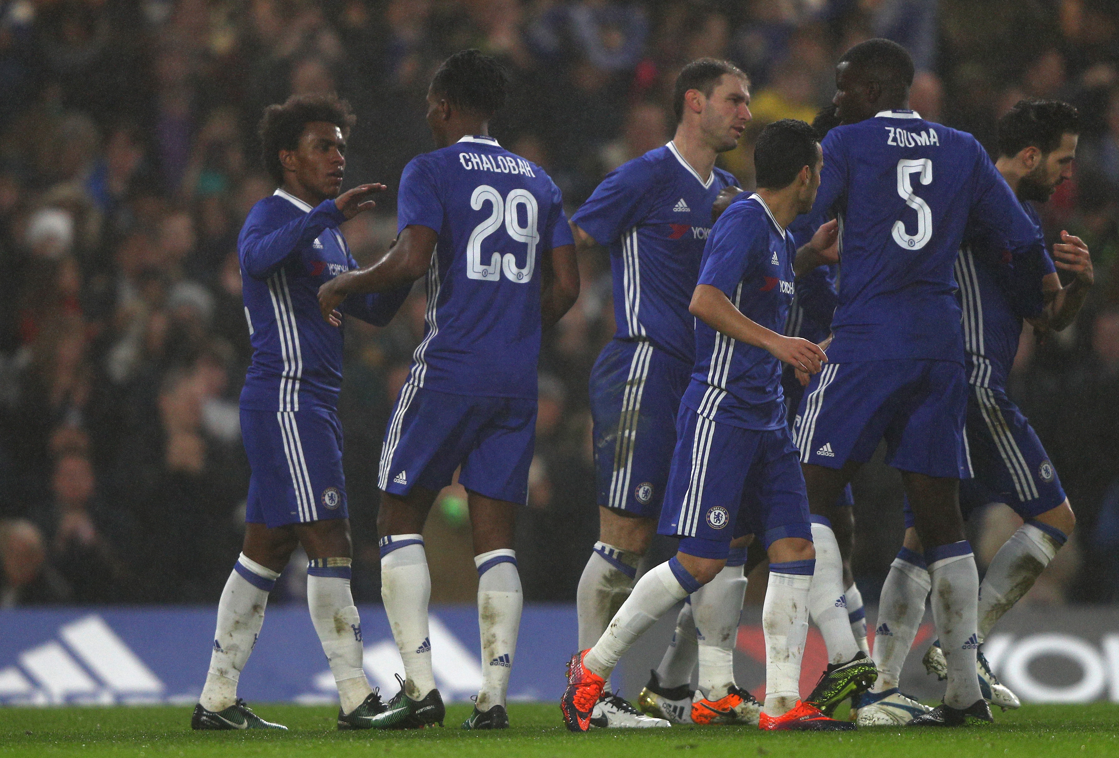 LONDON, ENGLAND - JANUARY 08: Willian of Chelsea (L celebrates scoring his sides third goal with Nathaniel Chalobah of Chelsea (C) during The Emirates FA Cup Third Round match between Chelsea and Peterborough United at Stamford Bridge on January 8, 2017 in London, England. (Photo by Ian Walton/Getty Images)