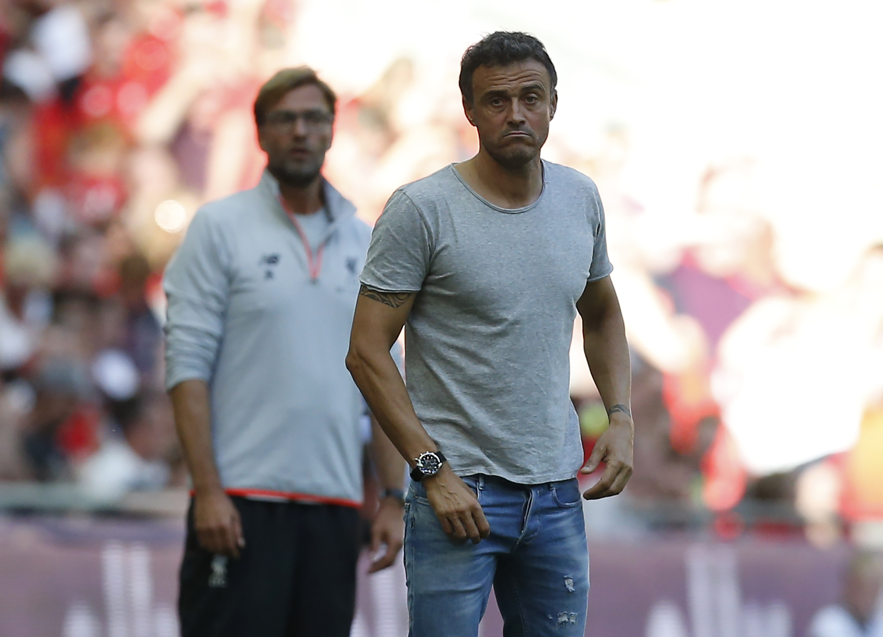 Barcelona's coach Luis Enrique (R) and Liverpool's German manager Jurgen Klopp watch from the touchline during the pre-season International Champions Cup football match between Spanish champions, Barcelona and Liverpool at Wembley stadium in London on August 6, 2016. / AFP / Ian KINGTON (Photo credit should read IAN KINGTON/AFP/Getty Images)