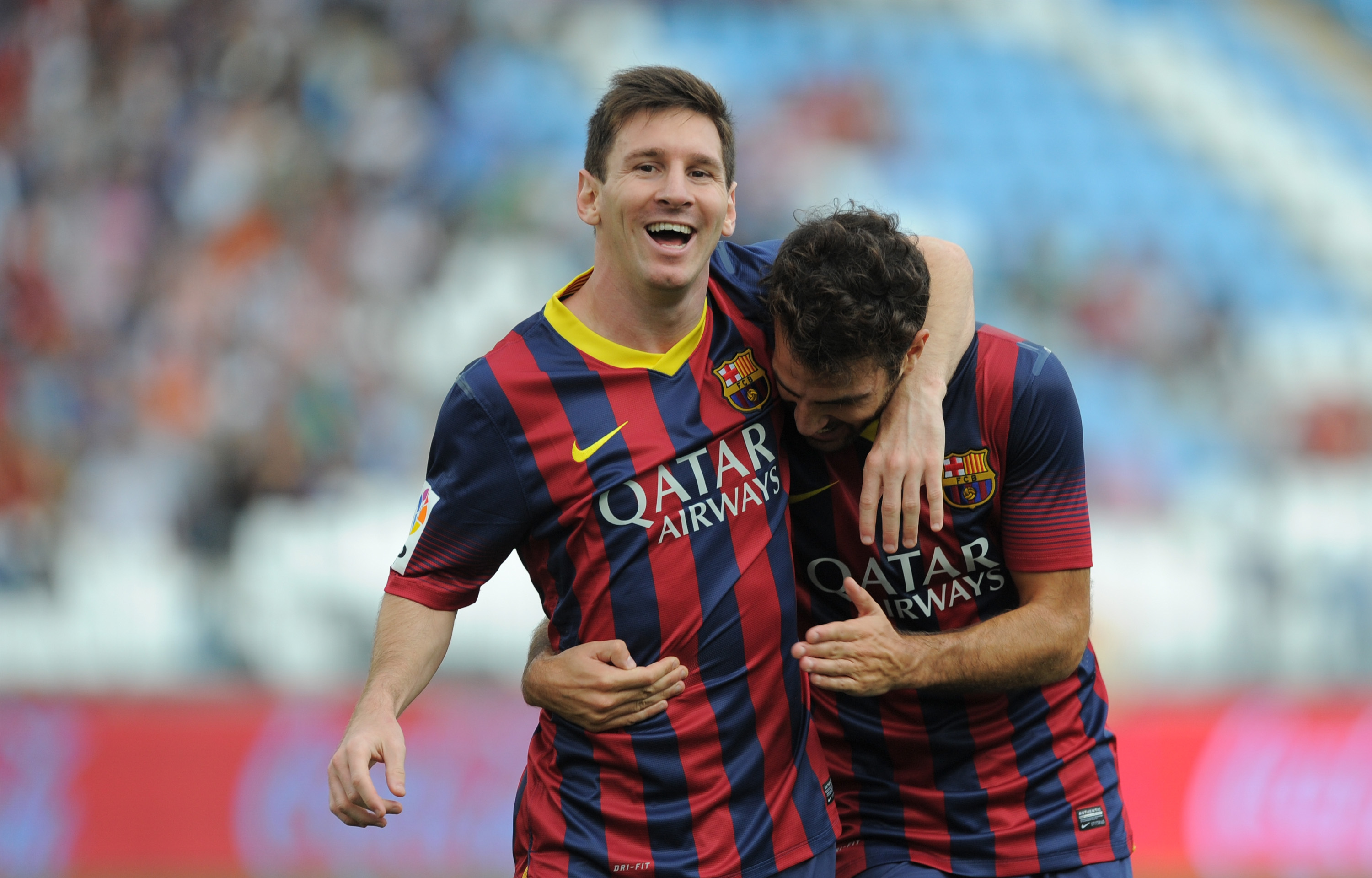 ALMERIA, SPAIN - SEPTEMBER 28: Lionel Messi (L) celebrates with Cesc Fabregas
after scoring FC Barcelona's opening goal during the La Liga match between UD Almeria and FC Barcelona on September 28, 2013 in Almeria, Spain. (Photo by Denis Doyle/Getty Images)