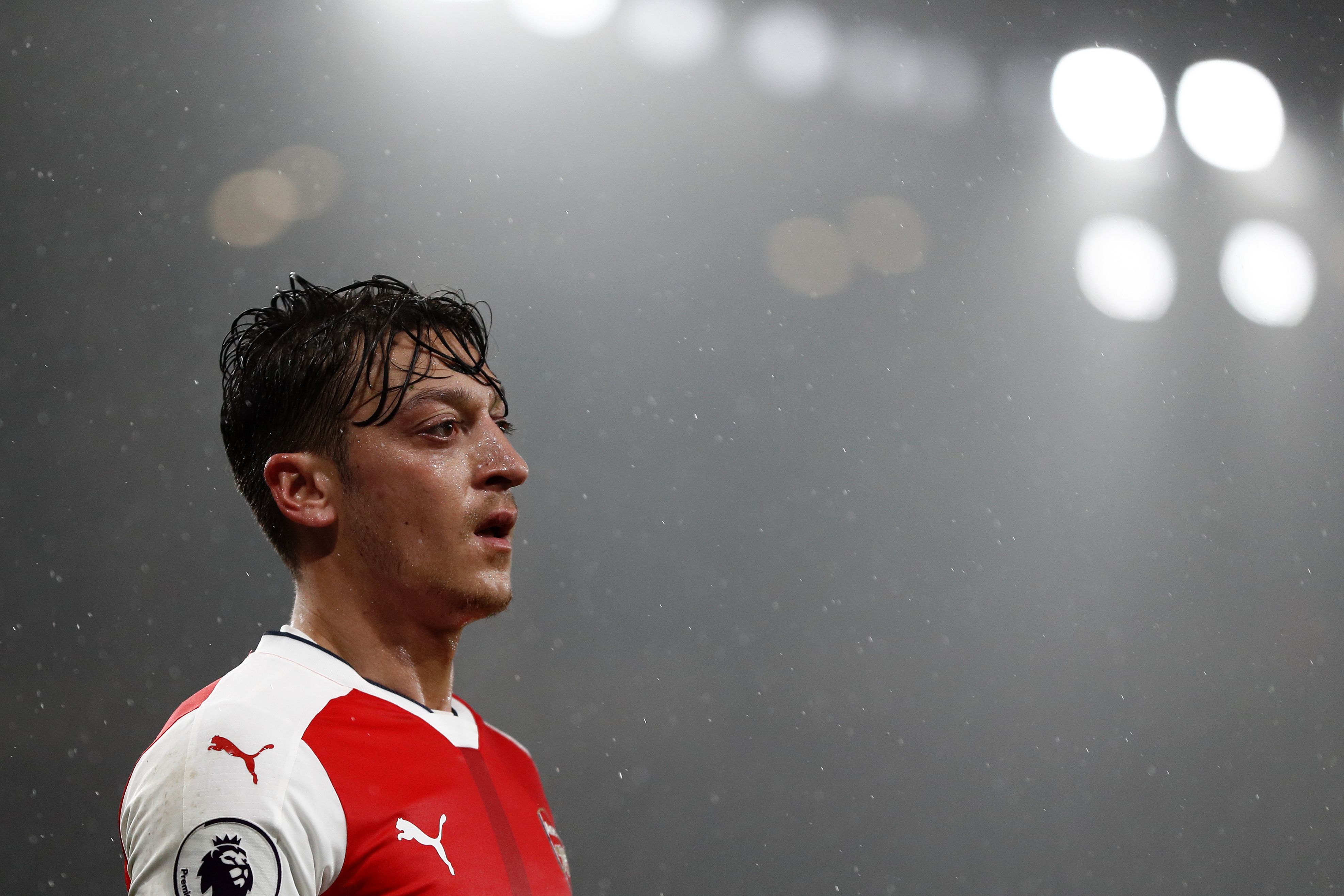 Arsenal's German midfielder Mesut Ozil reacts during the English Premier League football match between Arsenal and Watford at the Emirates Stadium in London on January 31, 2017. 
Watford won the match 2-1. / AFP / Adrian DENNIS / RESTRICTED TO EDITORIAL USE. No use with unauthorized audio, video, data, fixture lists, club/league logos or 'live' services. Online in-match use limited to 75 images, no video emulation. No use in betting, games or single club/league/player publications.  /         (Photo credit should read ADRIAN DENNIS/AFP/Getty Images)