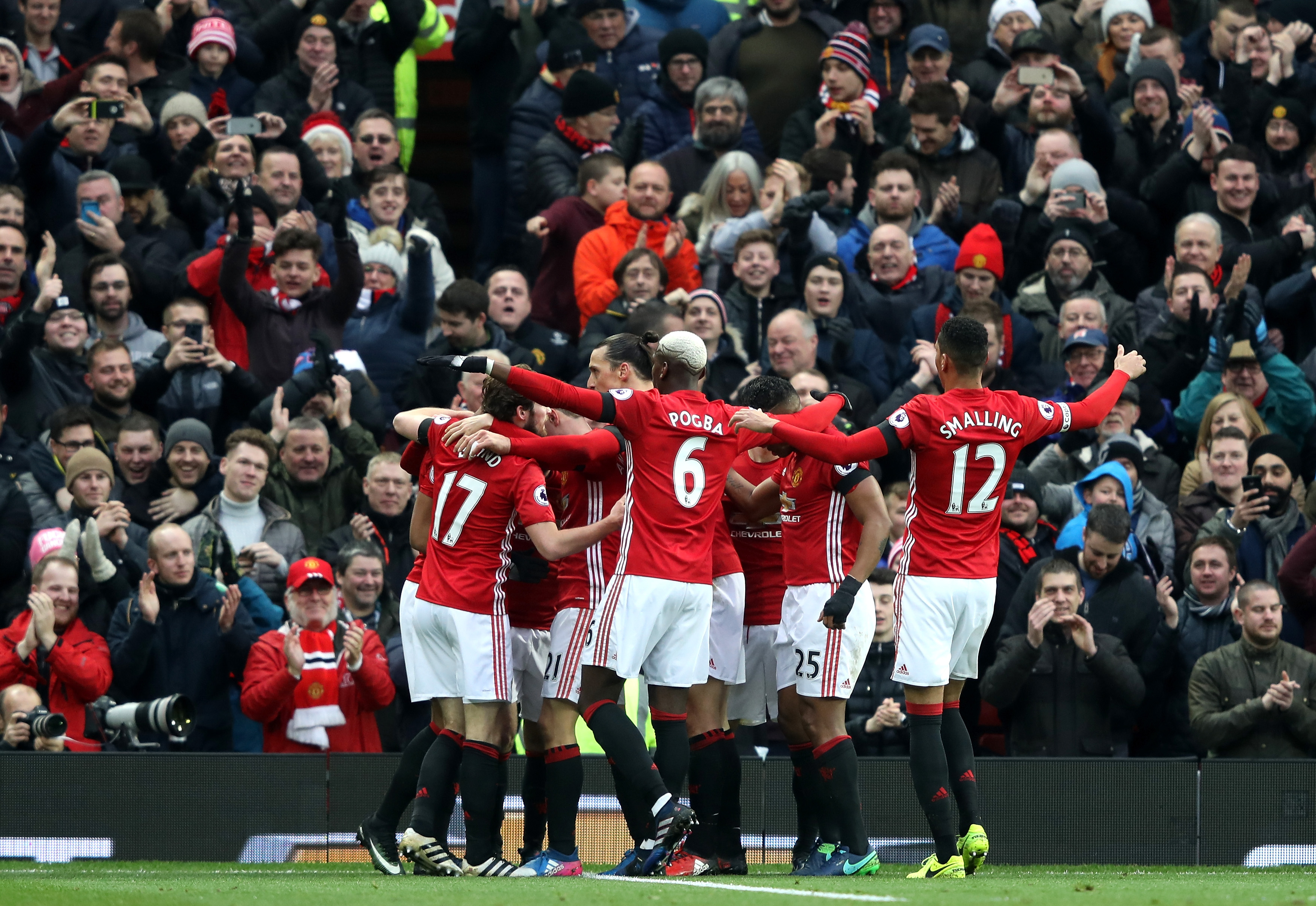 MANCHESTER, ENGLAND - FEBRUARY 11: Manchester United players celebrate their first goal by Juan Mata (obscured) during the Premier League match between Manchester United and Watford at Old Trafford on February 11, 2017 in Manchester, England. (Photo by Mark Thompson/Getty Images)
