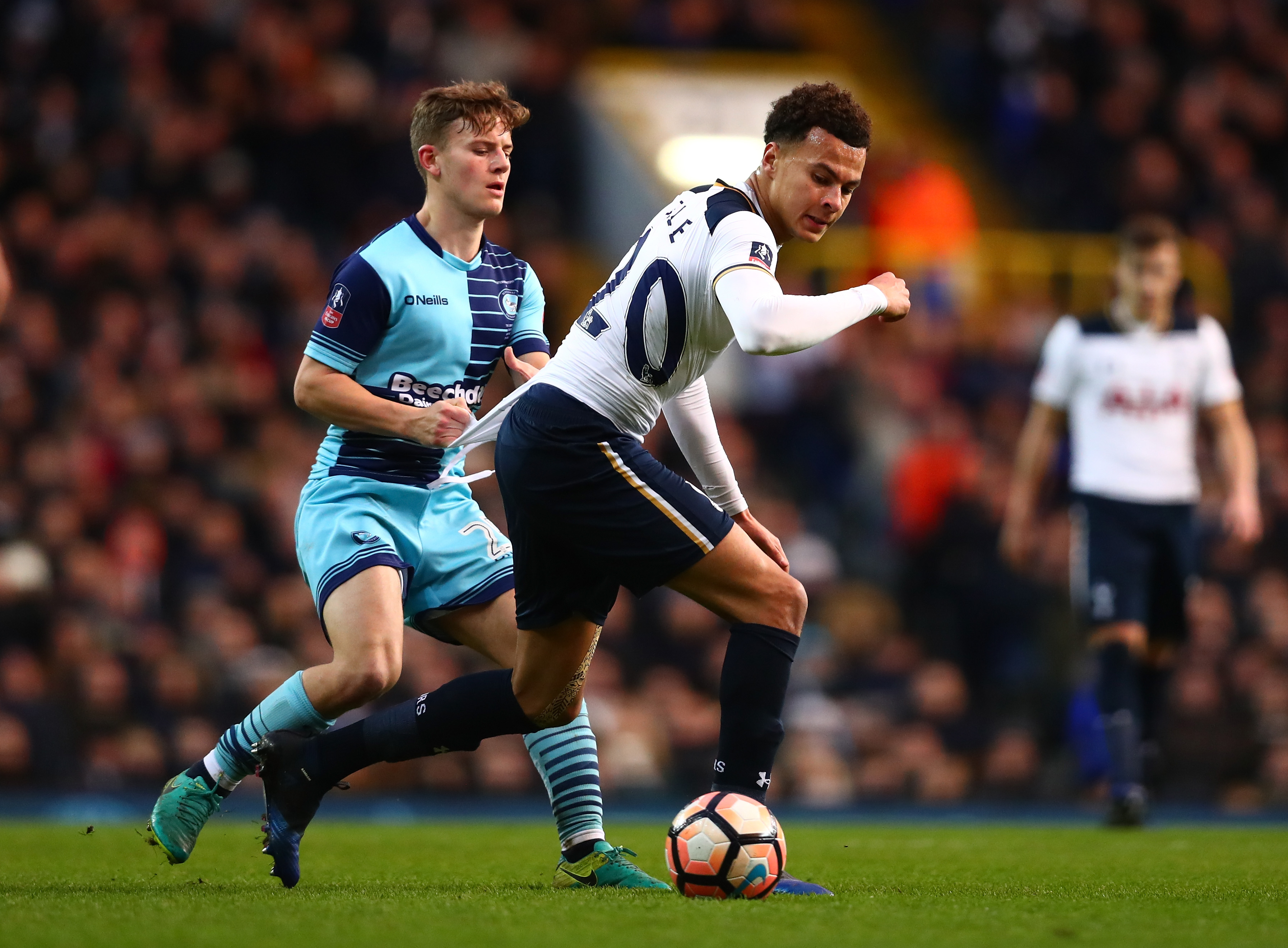 LONDON, ENGLAND - JANUARY 28: Dele Alli of Tottenham Hotspur and Scott Kashket of Wycombe Wanderers compete for the ball during the Emirates FA Cup Fourth Round match between Tottenham Hotspur and Wycombe Wanderers at White Hart Lane on January 28, 2017 in London, England. (Photo by Dan Istitene/Getty Images)