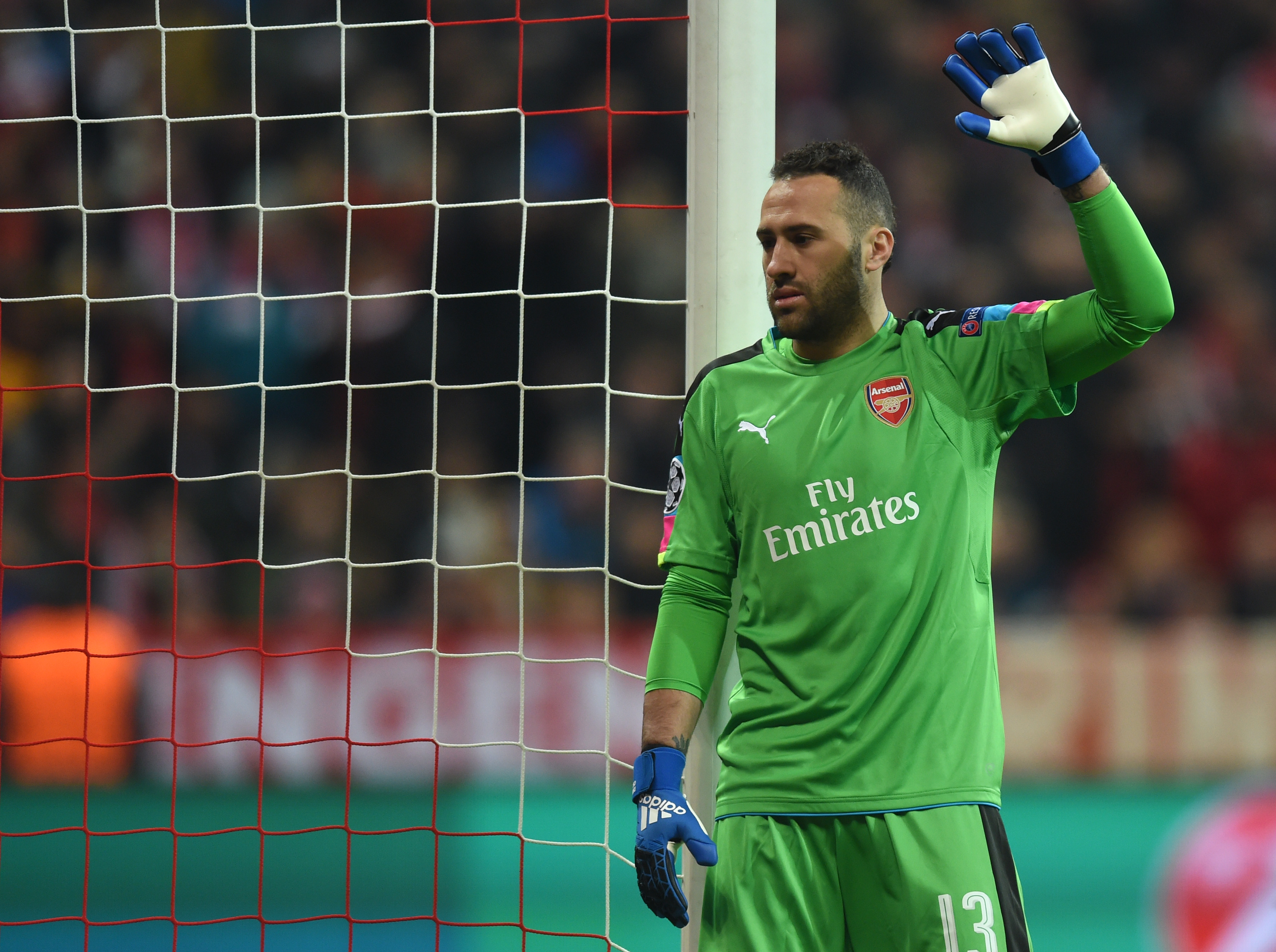 ArsenalÕs Colombian goalkeeper David Ospina gestures during the UEFA Champions League round of sixteen football match between FC Bayern Munich and Arsenal in Munich, southern Germany, on February 15, 2017. / AFP / Christof STACHE (Photo credit should read CHRISTOF STACHE/AFP/Getty Images)