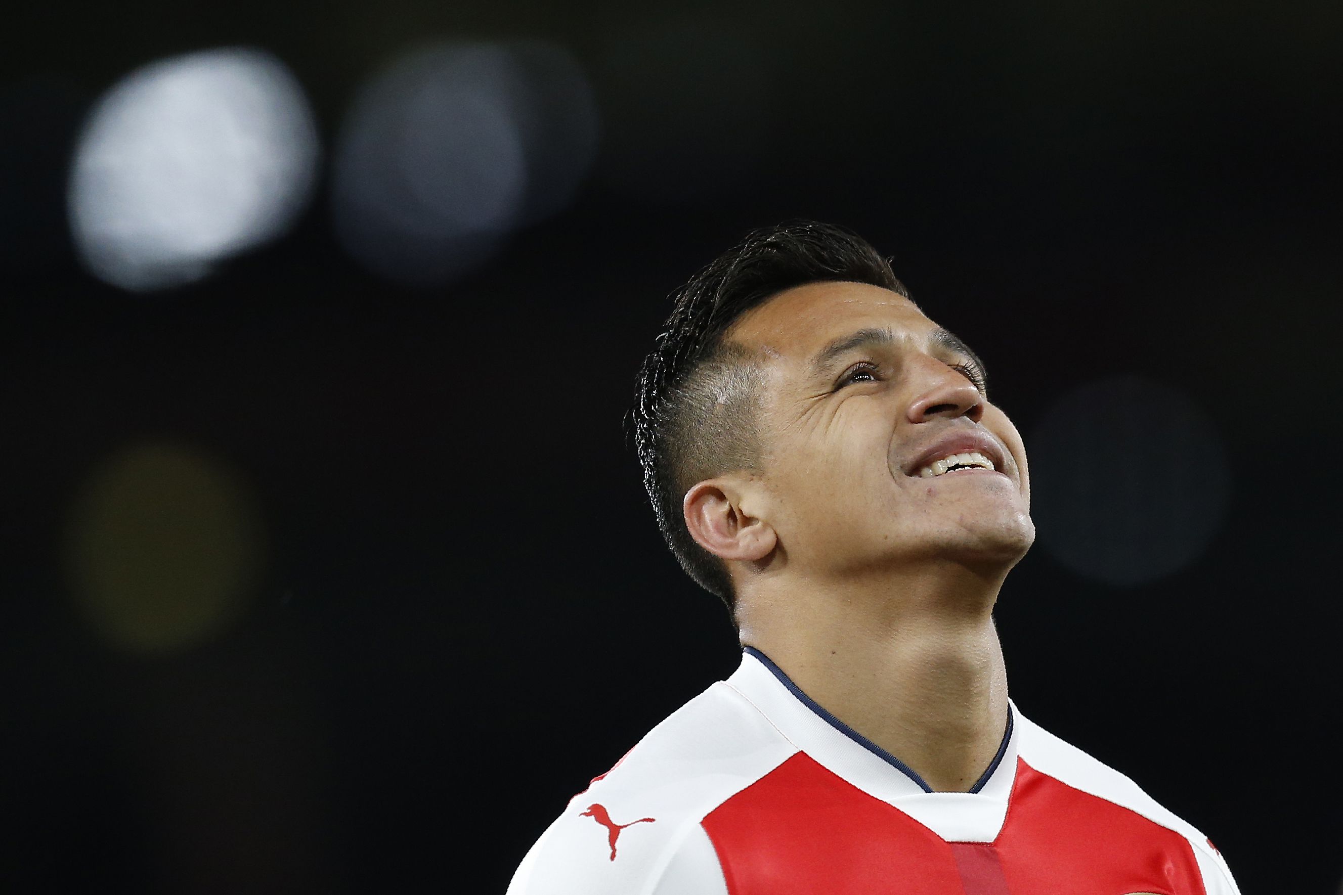 Arsenal's Chilean striker Alexis Sanchez reacts during the English Premier League football match between Arsenal and West Ham United at the Emirates Stadium in London on April 5, 2017. 
Arsenal won the match 3-0. / AFP PHOTO / Ian KINGTON / RESTRICTED TO EDITORIAL USE. No use with unauthorized audio, video, data, fixture lists, club/league logos or 'live' services. Online in-match use limited to 75 images, no video emulation. No use in betting, games or single club/league/player publications.  /         (Photo credit should read IAN KINGTON/AFP/Getty Images)