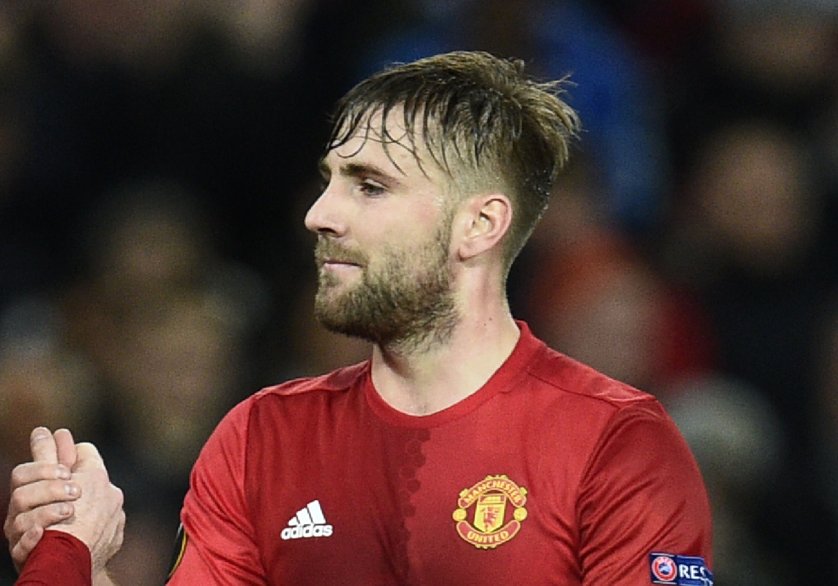 Manchester United's English striker Wayne Rooney (L) celebrates scoring the opening goal with Manchester United's English defender Luke Shaw (R) during the UEFA Europa League group A football match between Manchester United and Feyenoord at Old Trafford stadium in Manchester, north-west England, on November 24, 2016. / AFP / Oli SCARFF (Photo credit should read OLI SCARFF/AFP/Getty Images)