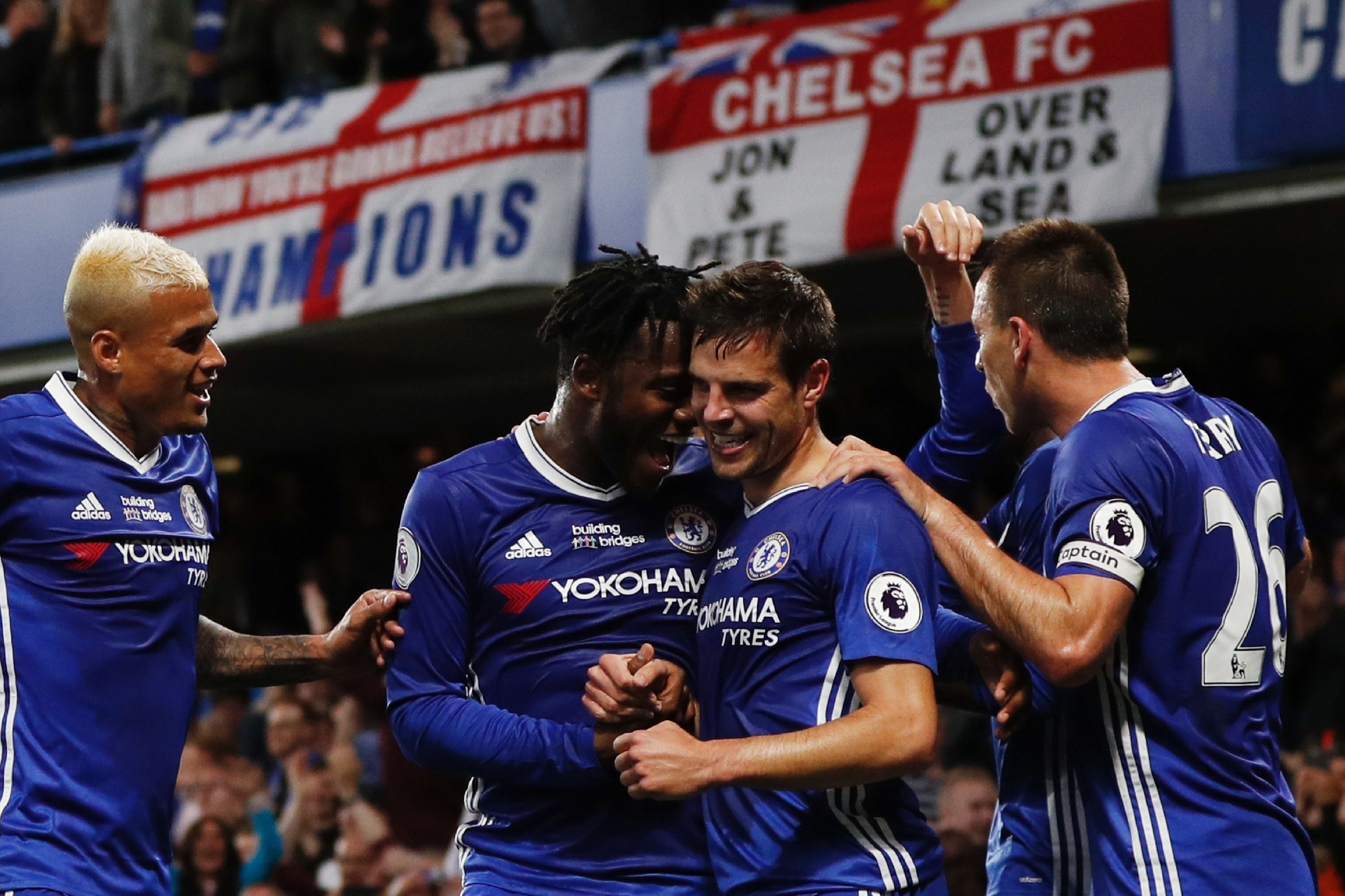 Chelsea's Spanish defender Cesar Azpilicueta (CR) celebrates scoring their second goal during the English Premier League football match between Chelsea and Watford at Stamford Bridge in London on May 15, 2017. / AFP PHOTO / Adrian DENNIS / RESTRICTED TO EDITORIAL USE. No use with unauthorized audio, video, data, fixture lists, club/league logos or 'live' services. Online in-match use limited to 75 images, no video emulation. No use in betting, games or single club/league/player publications. / (Photo credit should read ADRIAN DENNIS/AFP/Getty Images)