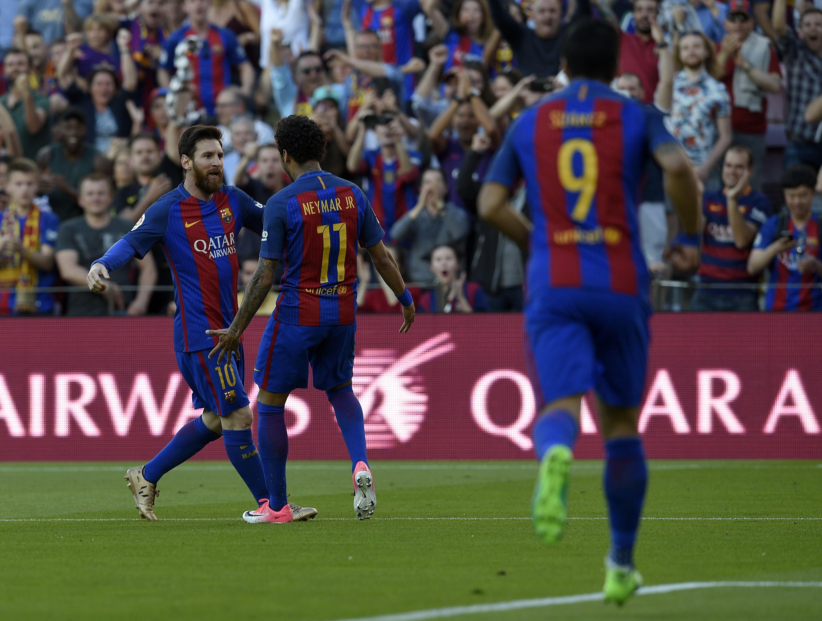 Barcelona's Argentinian forward Lionel Messi (L) celebrates with Barcelona's Brazilian forward Neymar after scoring a goal during the Spanish league football match FC Barcelona vs Villarreal CF at the Camp Nou stadium in Barcelona on May 6, 2017. / AFP PHOTO / LLUIS GENE        (Photo credit should read LLUIS GENE/AFP/Getty Images)