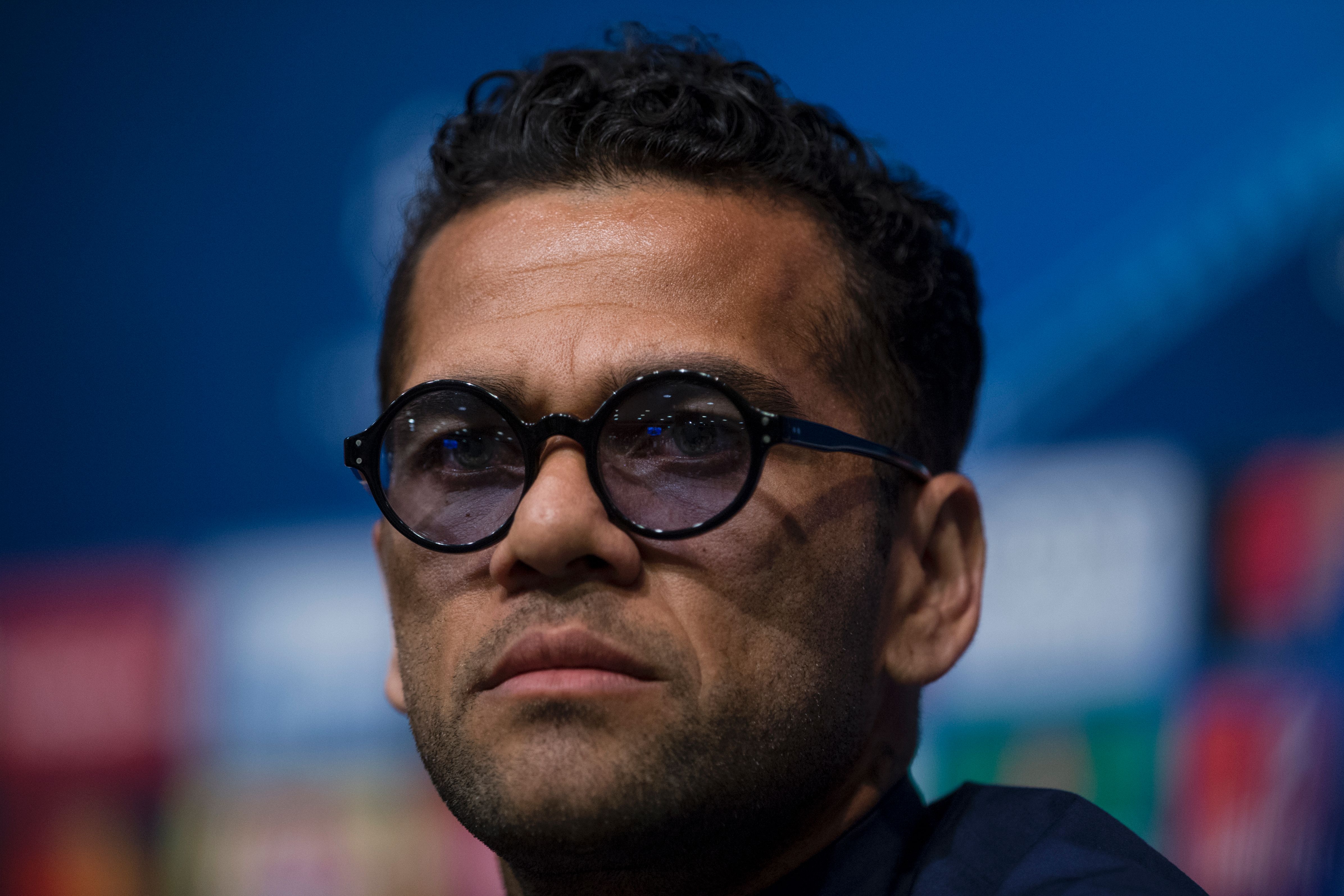 Juventus' Brazilian defender Dani Alves gestures during a press conference at the Camp Nou stadium in Barcelona on April 18, 2017 on the eve of the UEFA Champions League quarter-final second leg football match FC Barcelona vs Juventus. / AFP PHOTO / Josep LAGO        (Photo credit should read JOSEP LAGO/AFP/Getty Images)