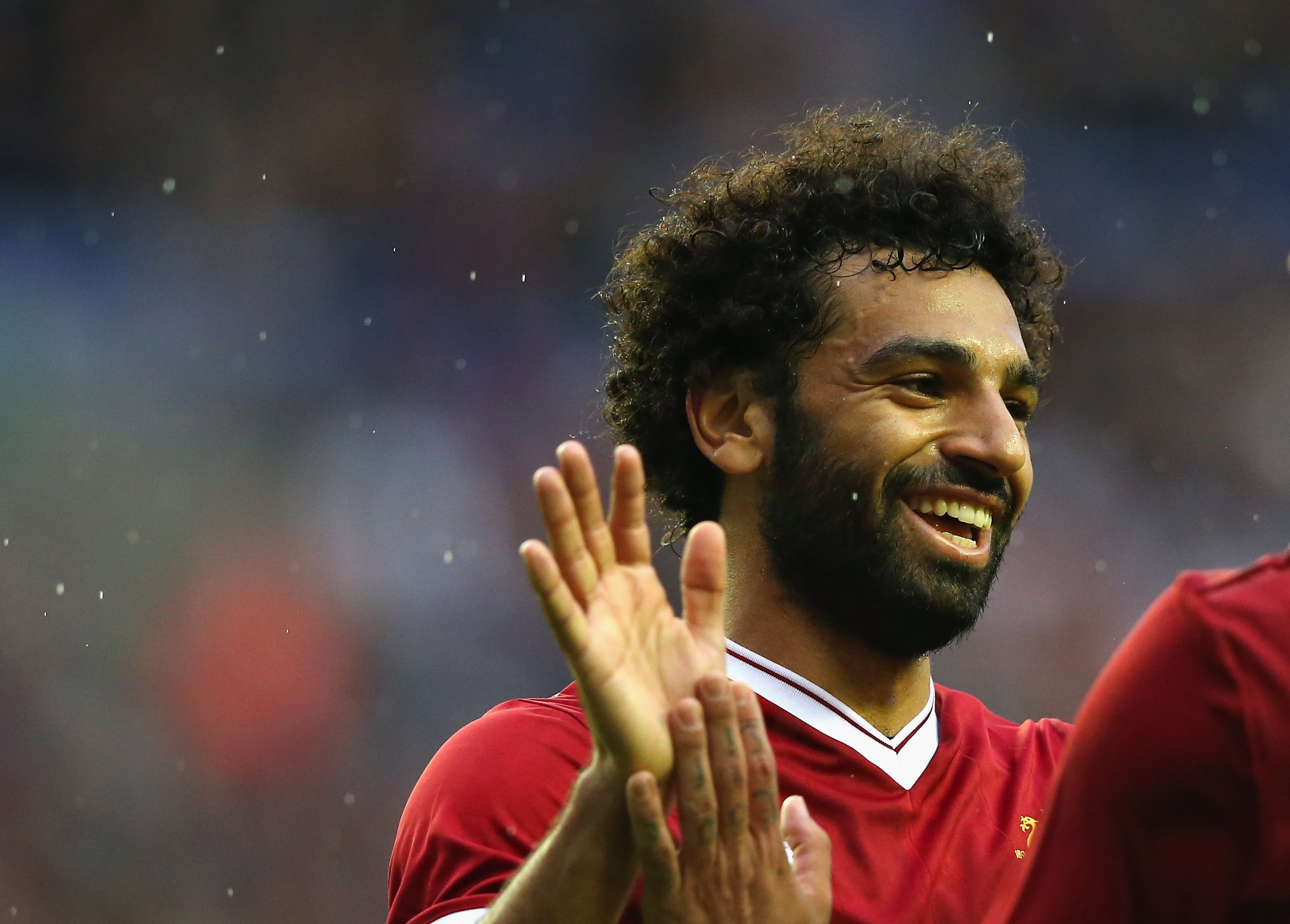 WIGAN, ENGLAND - JULY 14:  Mohamed Salah of Liverpool celebrates with Roberto Firmino after scoring their first goal during the pre-season friendly match between Wigan Athletic and Liverpool at DW Stadium on July 14, 2017 in Wigan, England.  (Photo by Alex Livesey/Getty Images)