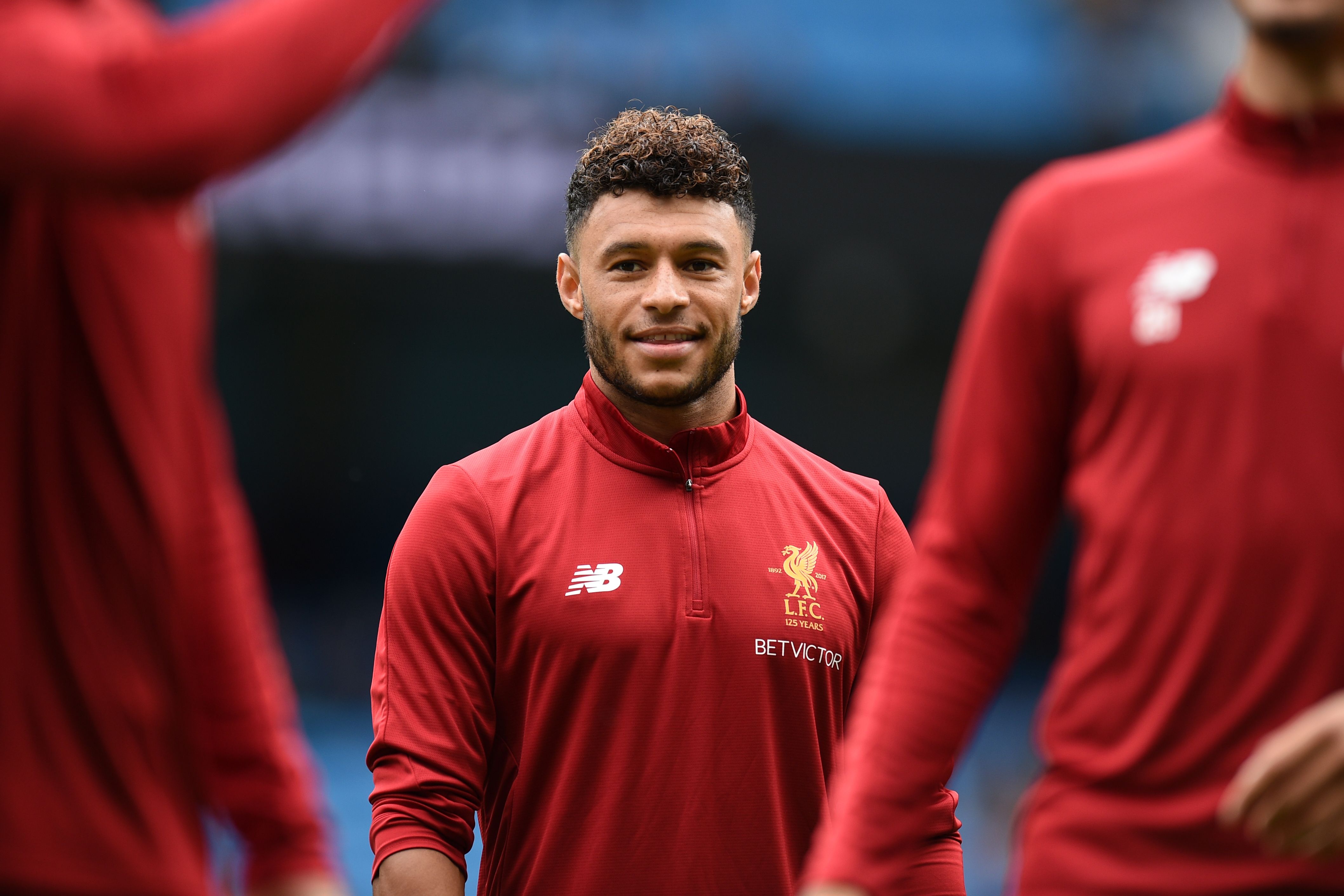 All smiles ahead of a first start in red. (Photo courtesy - Oli Scarff/AFP/Getty Images)