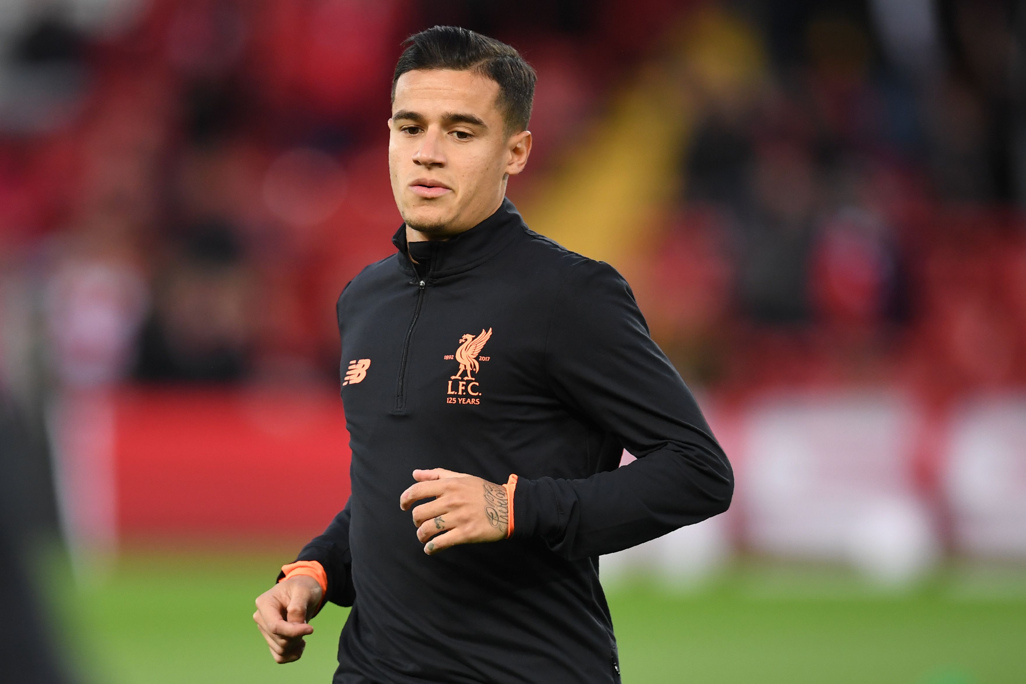 Liverpool's Brazilian midfielder Philippe Coutinho warms up before the UEFA Champions League Group E football match between Liverpool and Sevilla at Anfield in Liverpool, north-west England on September 13, 2017. / AFP PHOTO / Paul ELLIS (Photo credit should read PAUL ELLIS/AFP/Getty Images)
