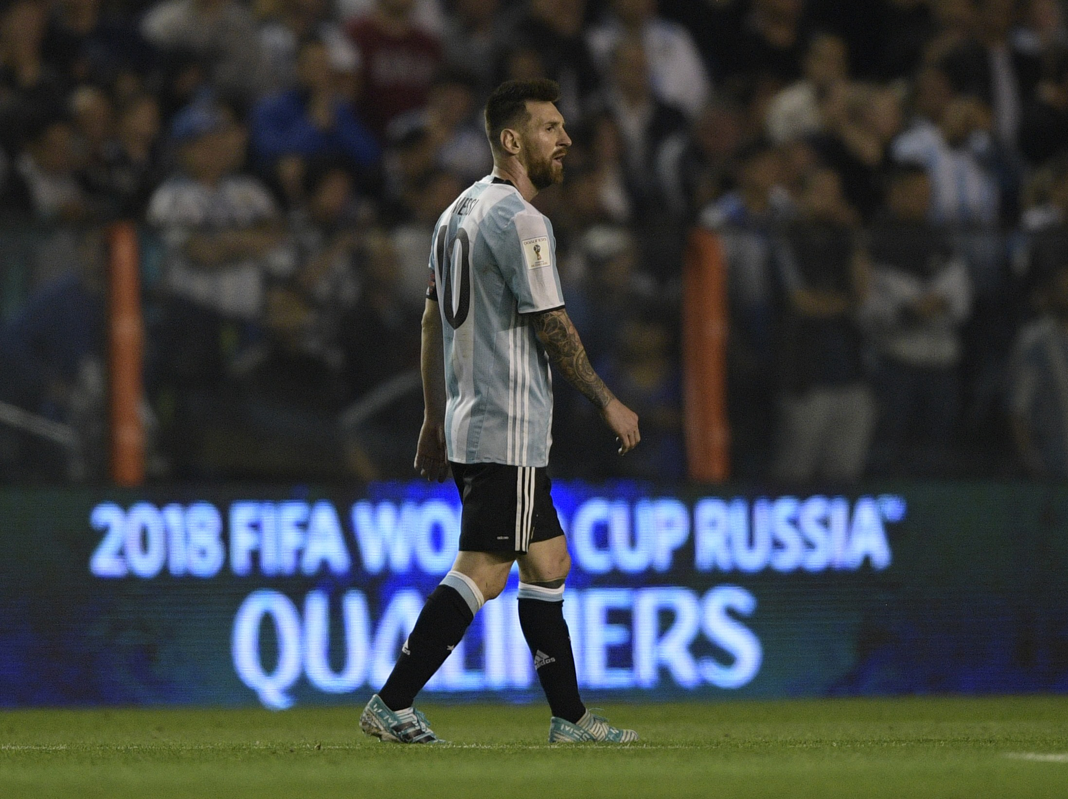 Argentina's Lionel Messi looks on during the 2018 World Cup qualifier football match against Peru in Buenos Aires on October 5, 2017. / AFP PHOTO / Juan MABROMATA (Photo credit should read JUAN MABROMATA/AFP/Getty Images)