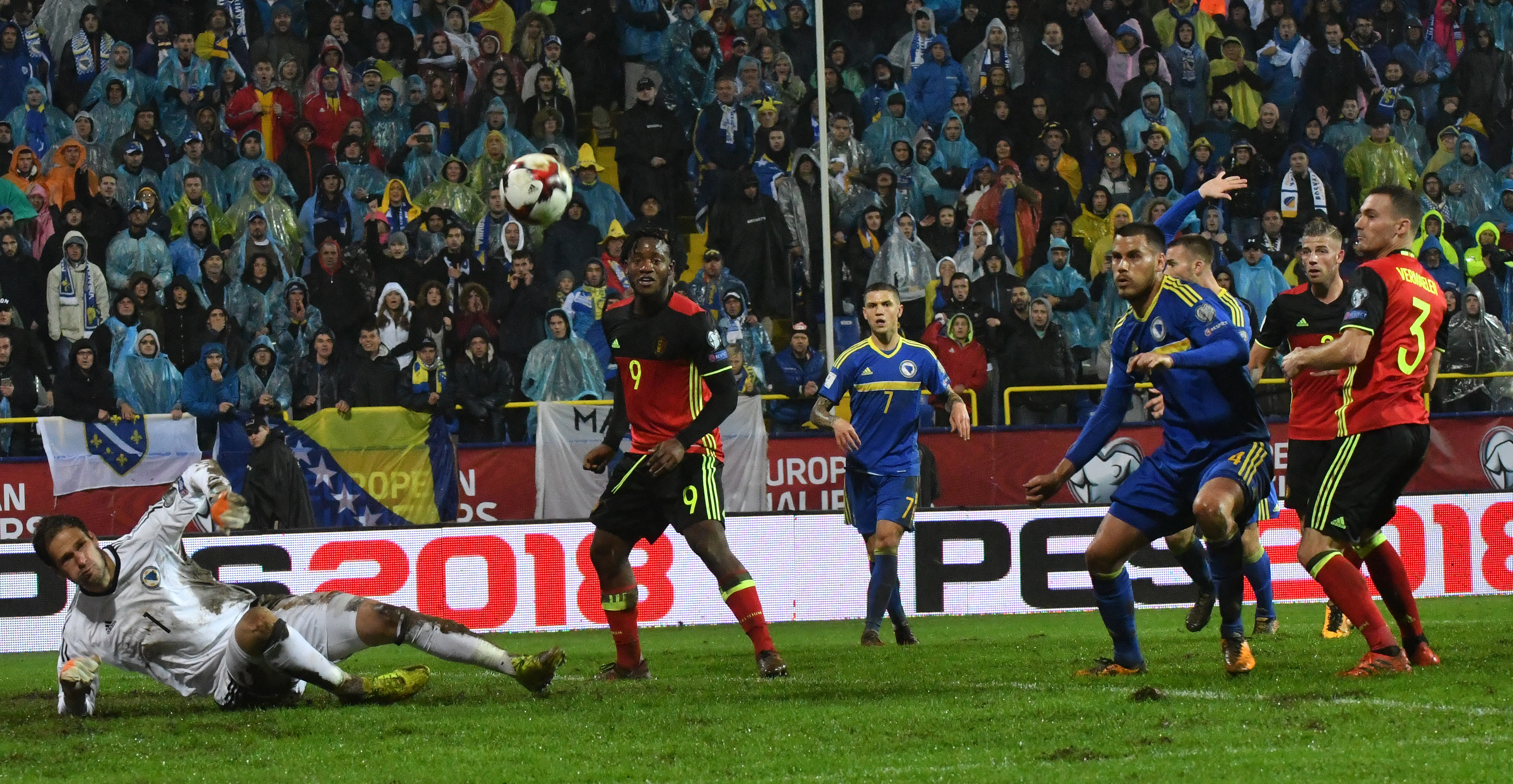 Goalkeeper Asmir Begovic of Bosnia and Herzegovina (1st-L) makes a save after a shot by Belgium's Michy Batshuayl (2nd-L) during the FIFA World Cup 2018 qualification football match between Bosnia and Herzegovina and Belgium in Sarajevo on October 7, 2017. / AFP PHOTO / ELVIS BARUKCIC        (Photo credit should read ELVIS BARUKCIC/AFP/Getty Images)