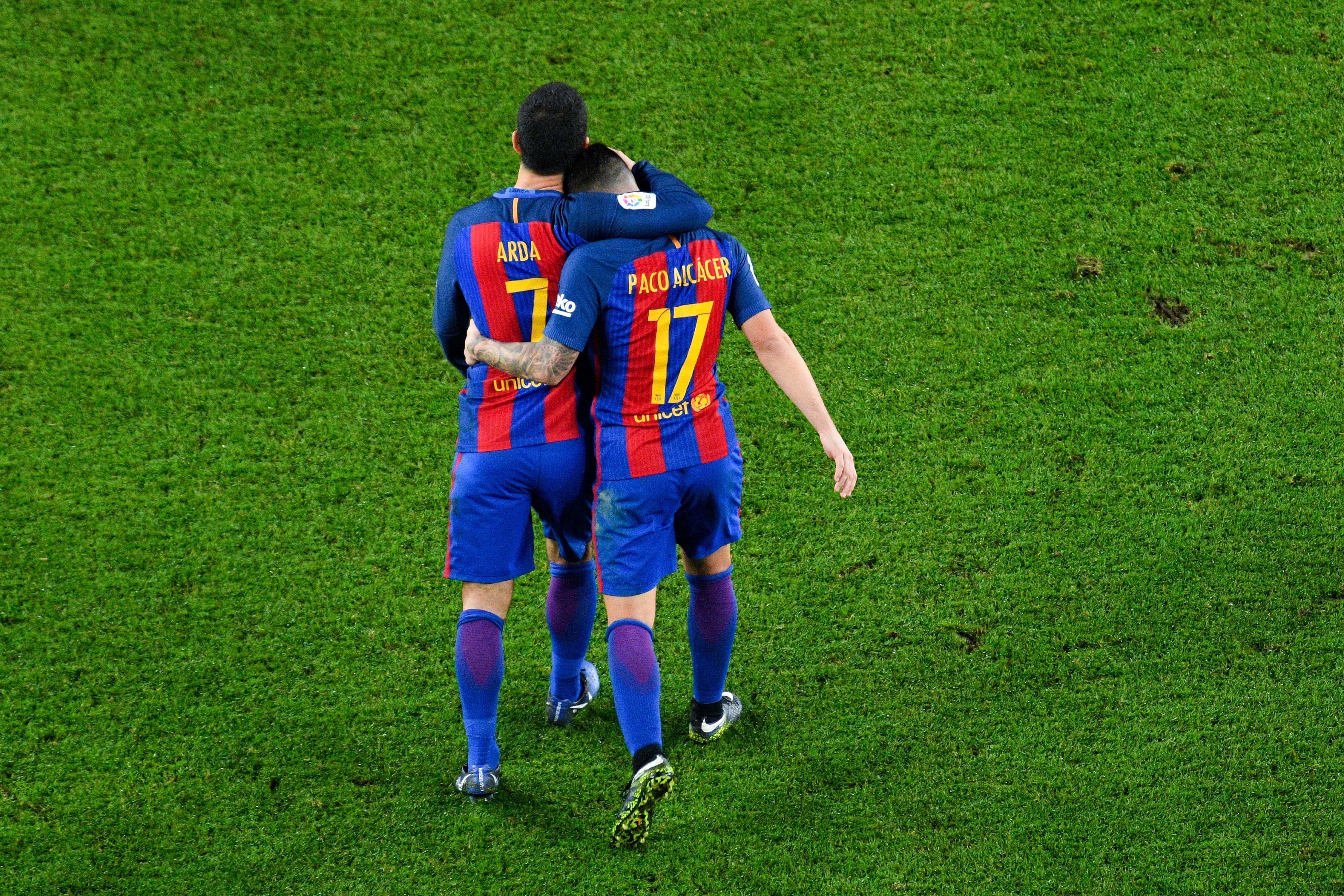 BARCELONA, SPAIN - DECEMBER 21: Paco Alcacer of FC Barcelona celebrates with his team mate Ardan Turan after scoring his team's fifth goal during the Copa del Rey round of 32 second leg match between FC Barcelona and Hercules at Camp Nou on December 21, 2016 in Barcelona, Spain. (Photo by David Ramos/Getty Images)