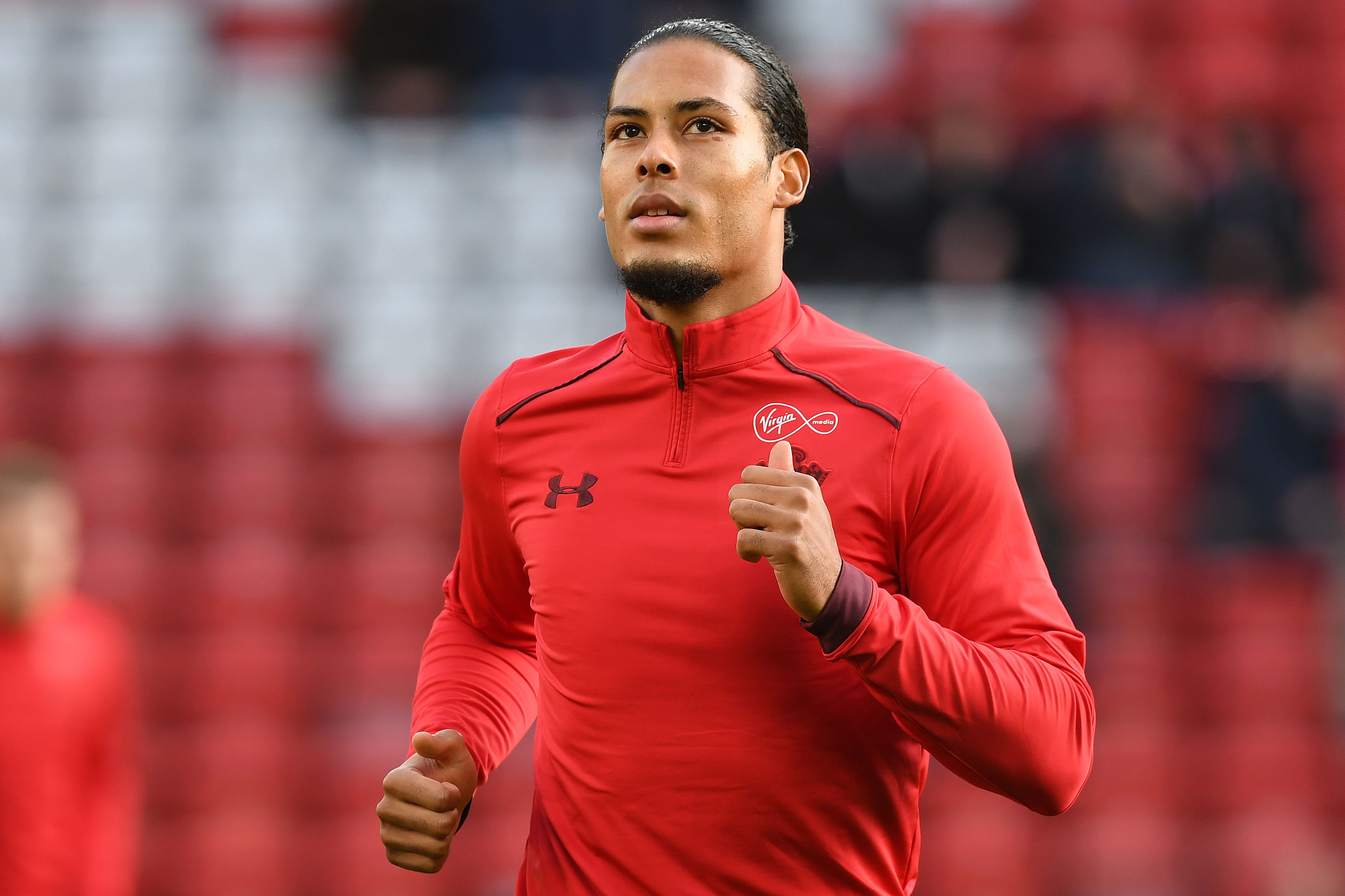 Southampton's Dutch defender Virgil van Dijk warms up ahead of the English Premier League football match between Liverpool and Southampton at Anfield in Liverpool, north west England on November 18, 2017. / AFP PHOTO / Paul ELLIS / RESTRICTED TO EDITORIAL USE. No use with unauthorized audio, video, data, fixture lists, club/league logos or 'live' services. Online in-match use limited to 75 images, no video emulation. No use in betting, games or single club/league/player publications. / (Photo credit should read PAUL ELLIS/AFP/Getty Images)