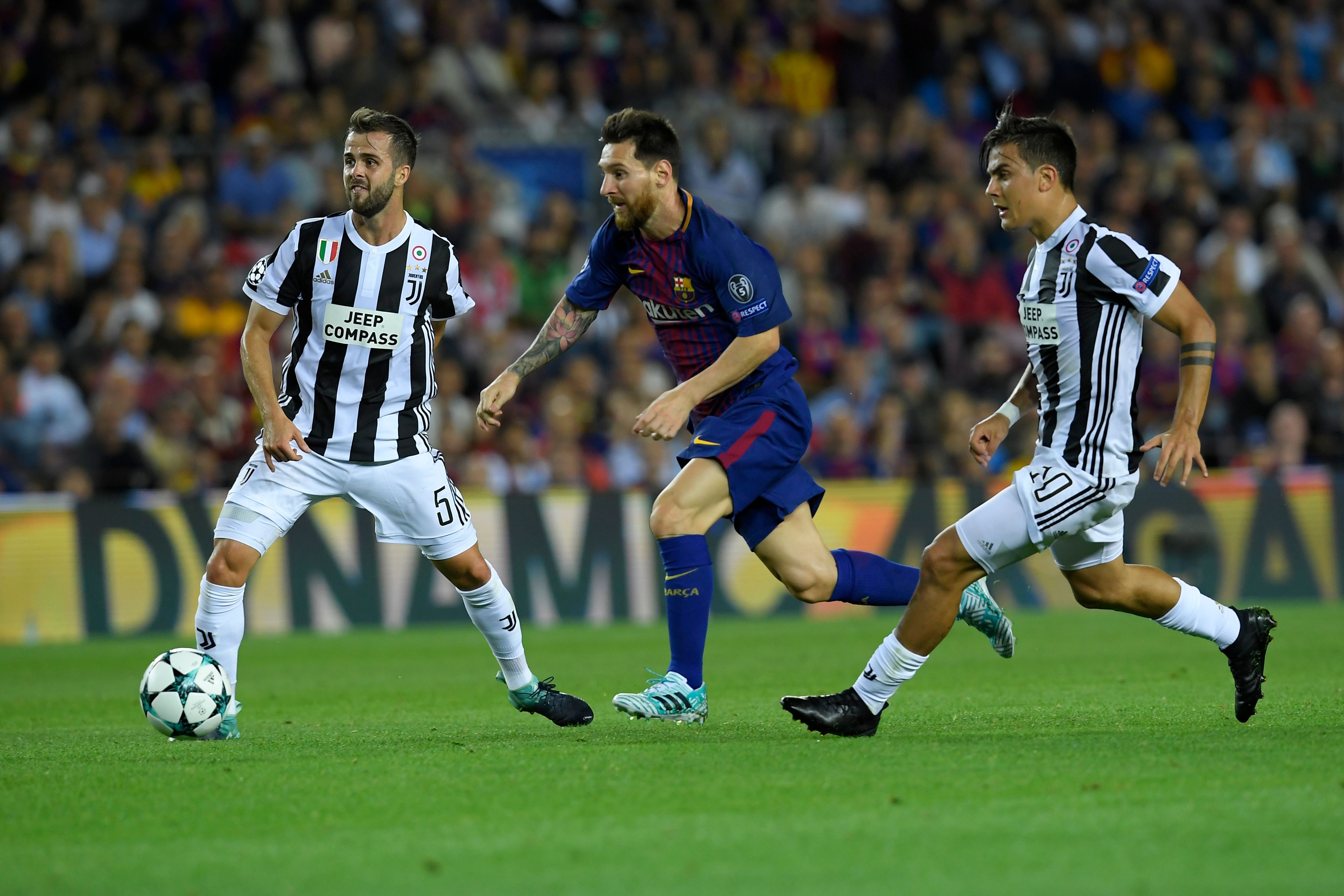 Barcelona's forward from Argentina Lionel Messi (C) vies with Juventus' midfielder from Bosnia-Herzegovina Miralem Pjanic (L) and Juventus' forward from Argentina Paulo Dybala during the UEFA Champions League Group D football match FC Barcelona vs Juventus at the Camp Nou stadium in Barcelona on September 12, 2017. / AFP PHOTO / LLUIS GENE (Photo credit should read LLUIS GENE/AFP/Getty Images)