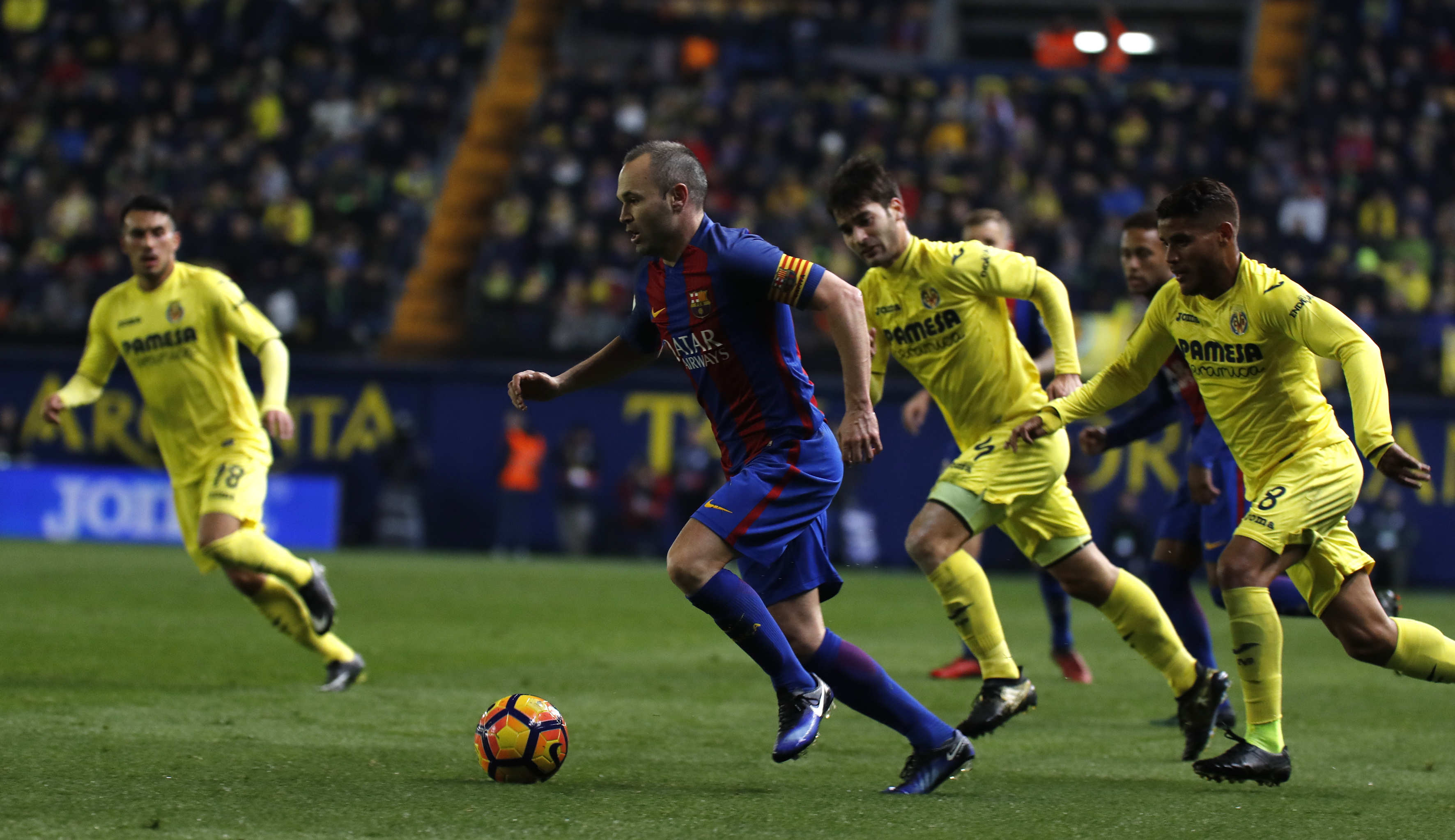 Barcelona's midfielder Andres Iniesta drives the ball during the Spanish league football match Villarreal CF vs FC Barcelona at El Madrigal stadium in Vila-real on January 8, 2017. / AFP / JOSE JORDAN        (Photo credit should read JOSE JORDAN/AFP/Getty Images)