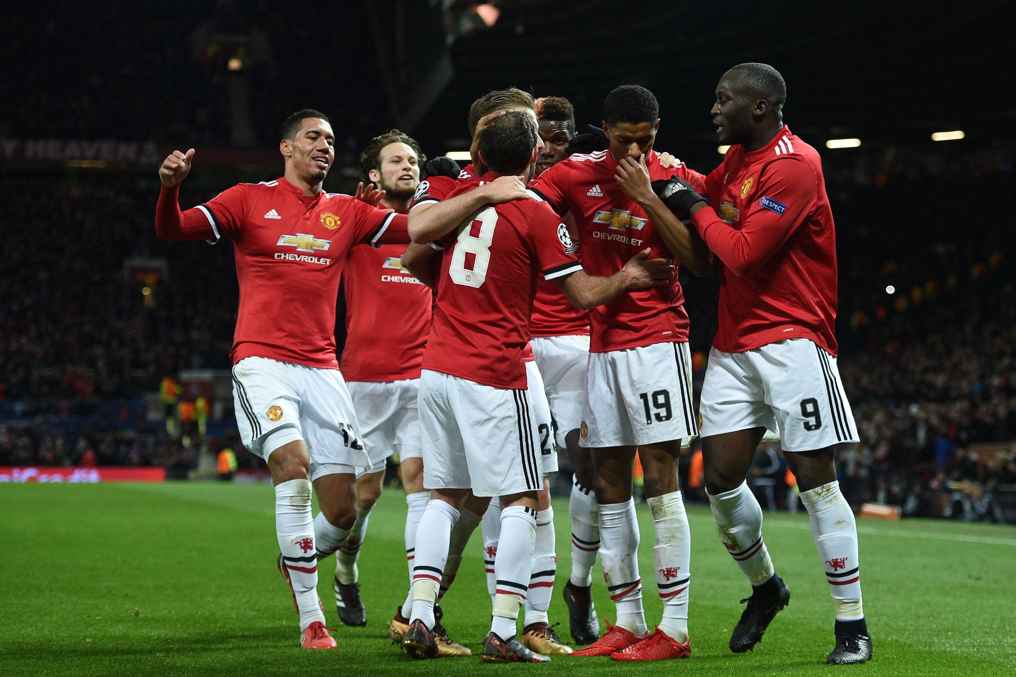 Manchester United's English striker Marcus Rashford (2nd R) celebrates with teammates after scoring their second goal during the UEFA Champions League Group A football match between Manchester United and CSKA Moscow at Old Trafford in Manchester, north west England on December 5, 2017. / AFP PHOTO / Oli SCARFF        (Photo credit should read OLI SCARFF/AFP/Getty Images)