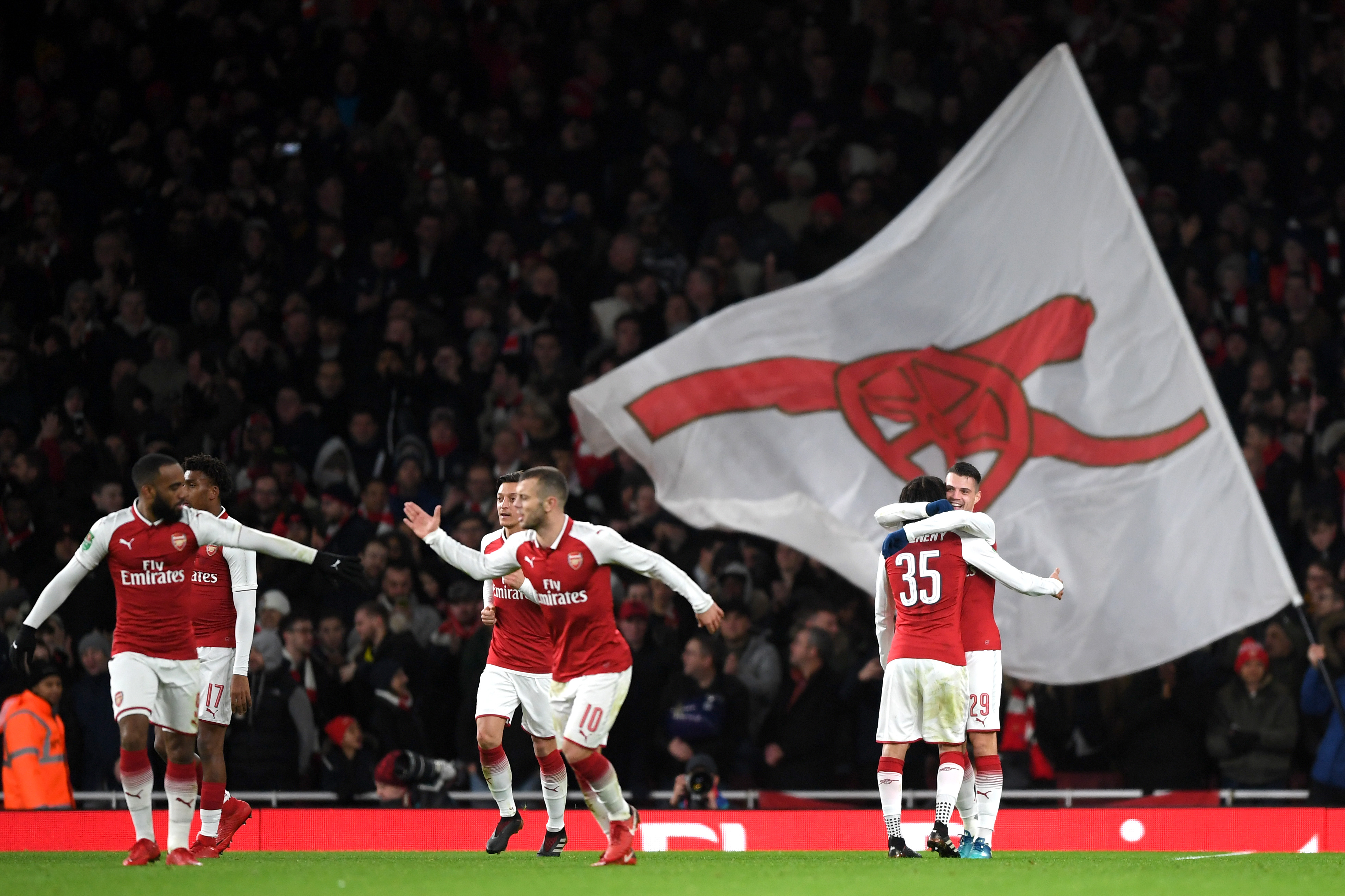 LONDON, ENGLAND - JANUARY 24: Granit Xhaka of Arsenal celebrates with team mates after scoring his sides second goal during the Carabao Cup Semi-Final Second Leg at Emirates Stadium on January 24, 2018 in London, England. (Photo by Shaun Botterill/Getty Images)