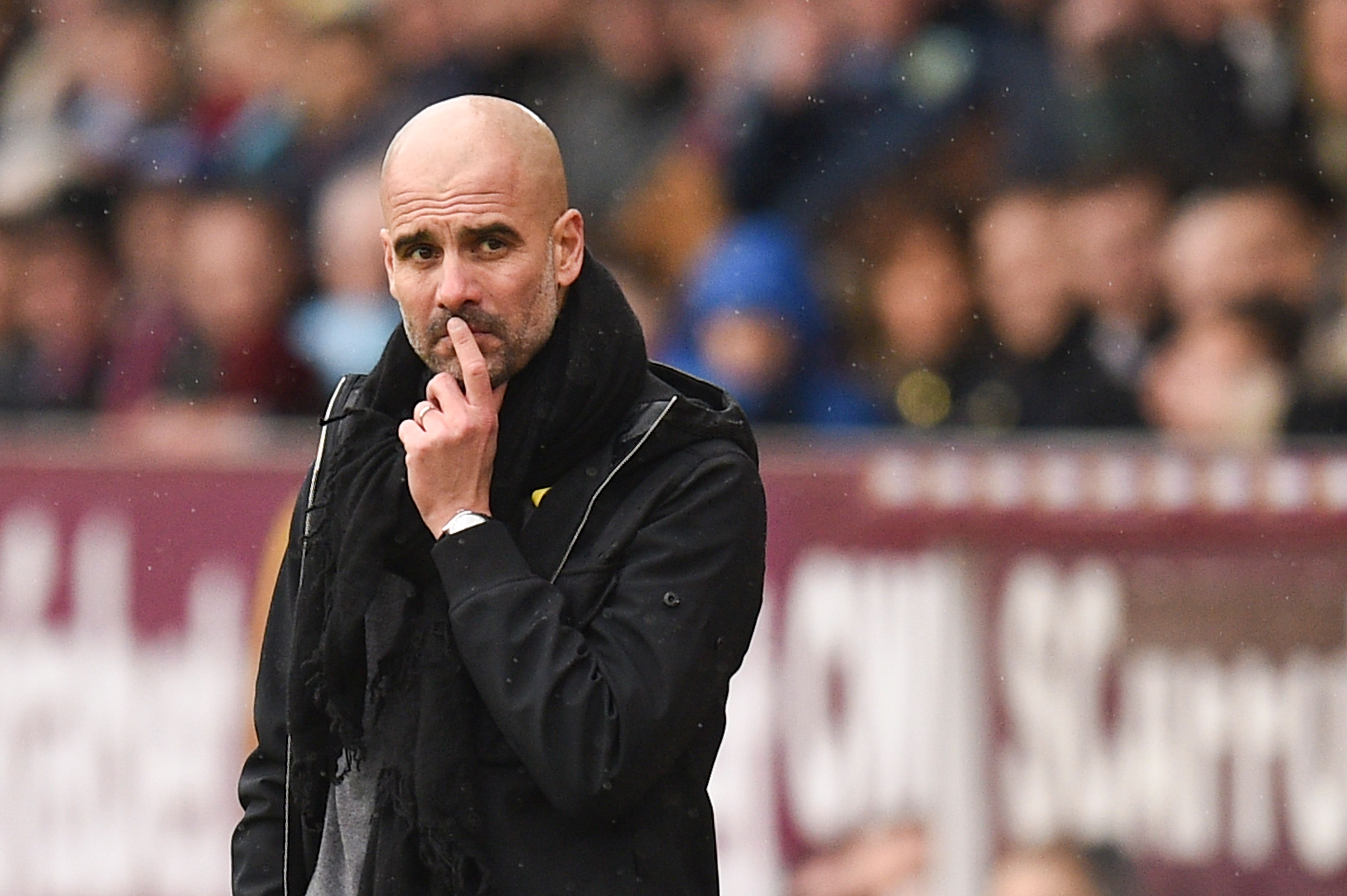 Manchester City's Spanish manager Pep Guardiola reacts on the touchline during the English Premier League football match between Burnley and Manchester City at Turf Moor in Burnley, north west England on February 3, 2018. / AFP PHOTO / Oli SCARFF / RESTRICTED TO EDITORIAL USE. No use with unauthorized audio, video, data, fixture lists, club/league logos or 'live' services. Online in-match use limited to 75 images, no video emulation. No use in betting, games or single club/league/player publications.  /         (Photo credit should read OLI SCARFF/AFP/Getty Images)